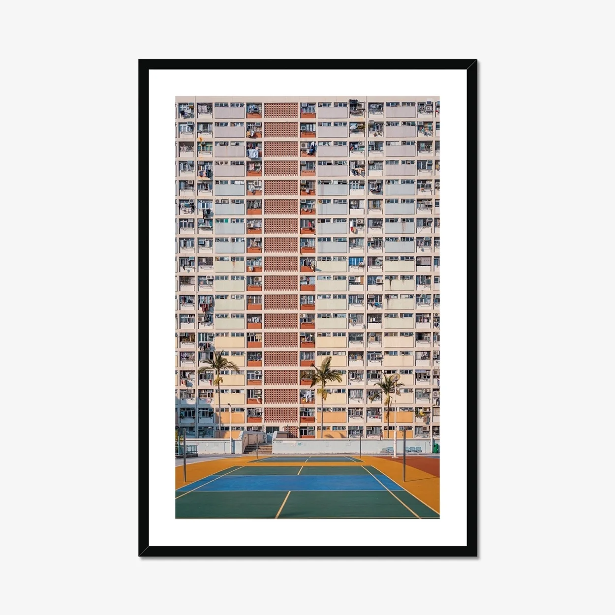 Professional architectural photography of the rainbow-colored Choi Hung Estate in Hong Kong, featuring the pastel building facade and basketball courts in the foreground.