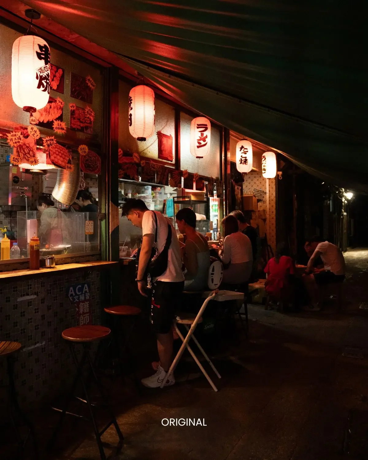 Neon Grunge preset on outdoor night food stall with warm lantern lighting and seated diners