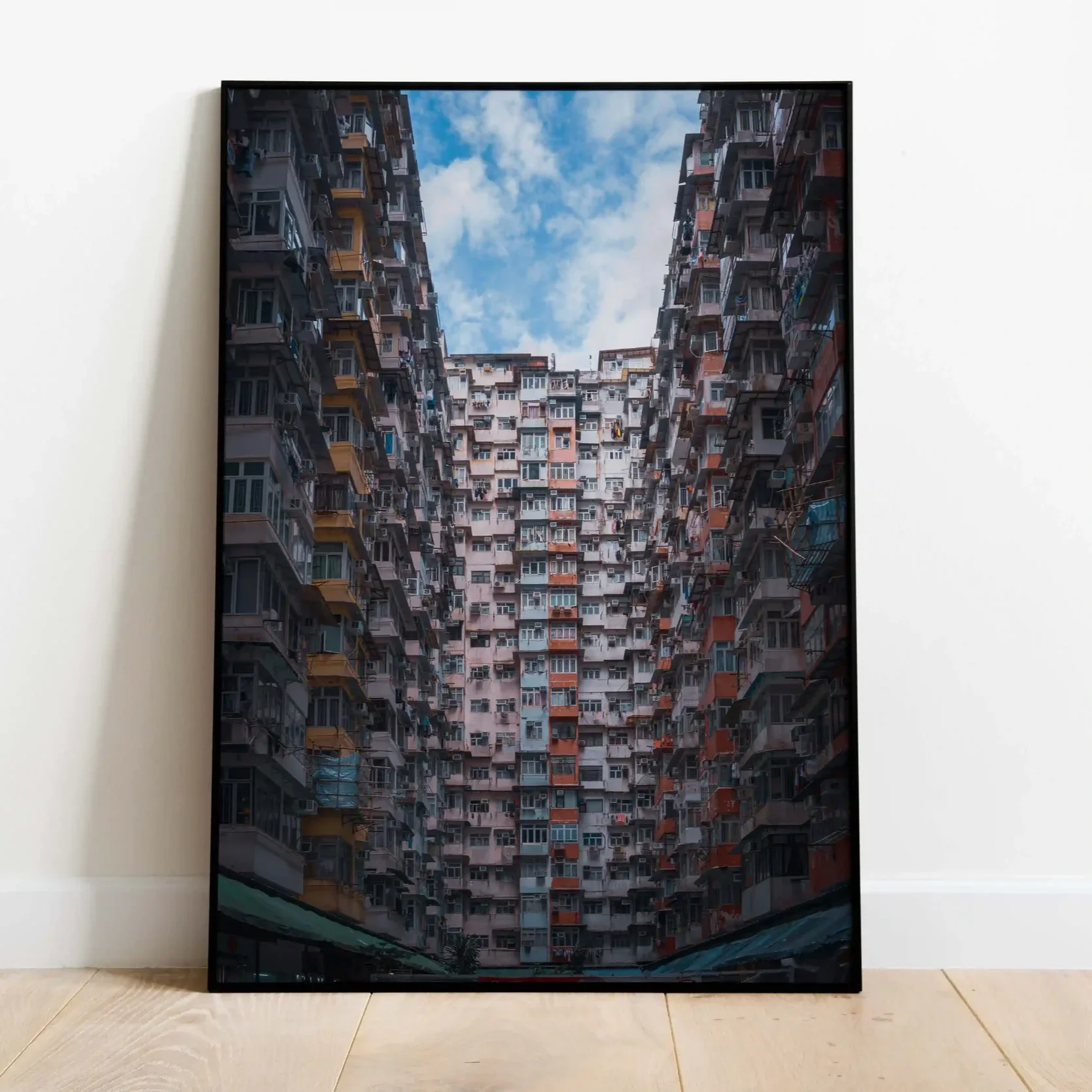 Symmetrical wide-angle photography of the massive Monster Building residential complex in Quarry Bay, Hong Kong.