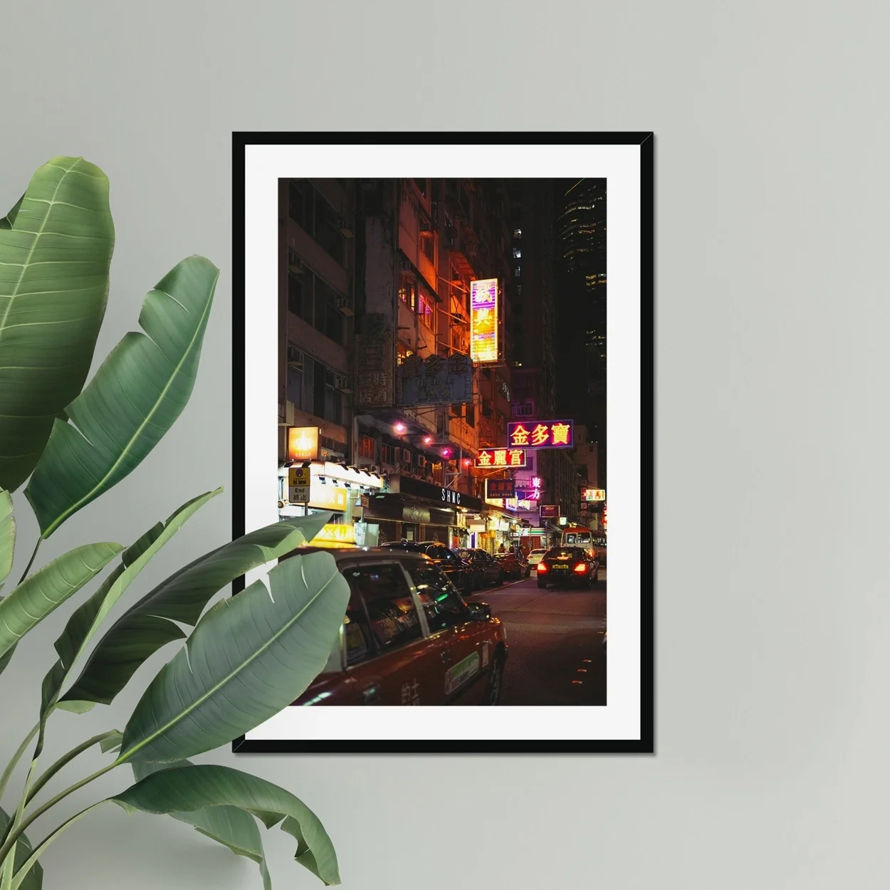 Cinematic night photography of a red taxi in Mong Kok Hong Kong, neon signs reflections on wet street, CineStill 50D film aesthetic, urban street documentary art.