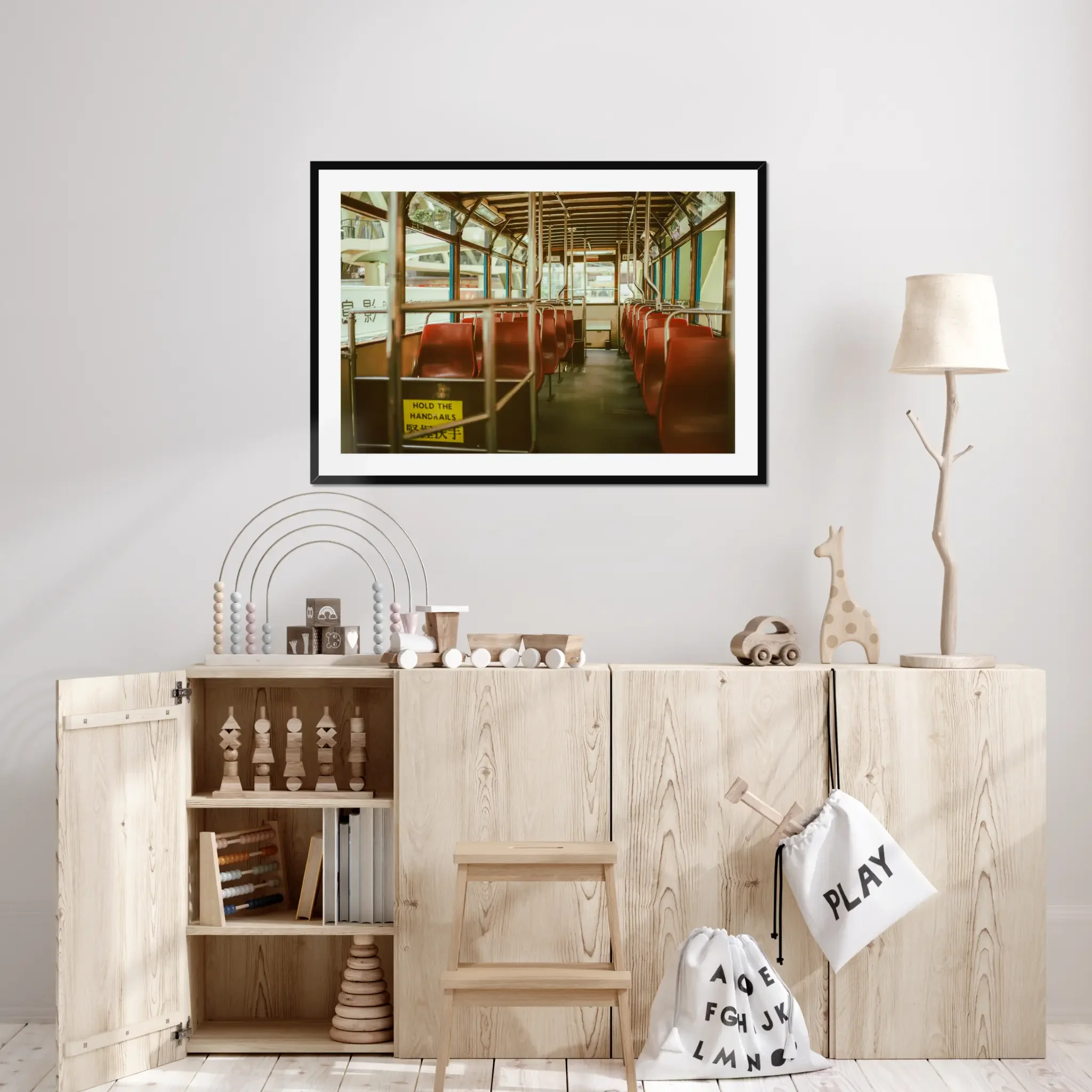 Vintage Hong Kong tram interior fine art print featuring red seats and a hold the handrails sign in warm cinematic tones.
