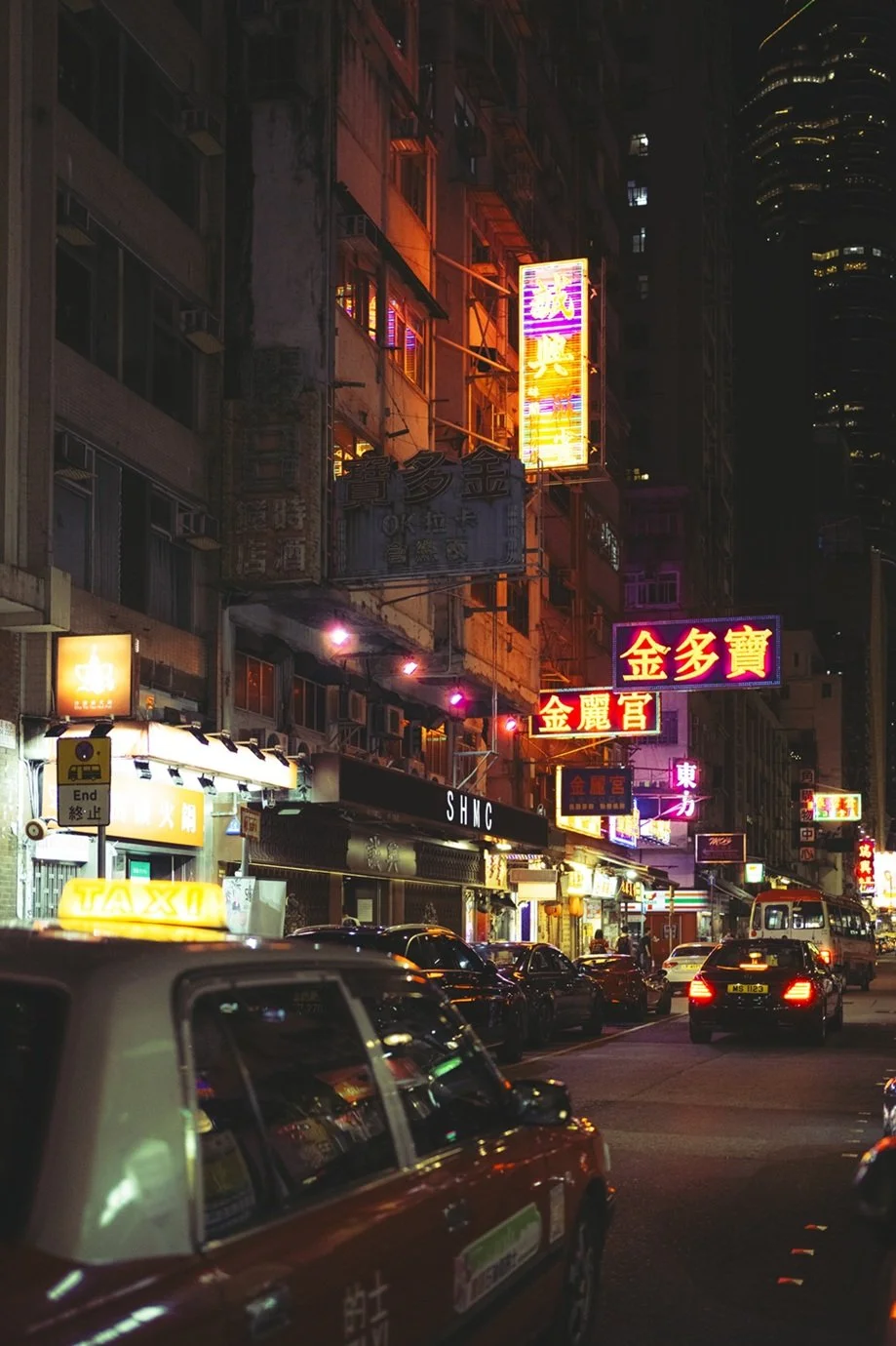 hong-kong-street-photography-neon-signs-cinematic-retro-Cinestill-vintage-taxi-urban-night-ejduranphotography.jpg