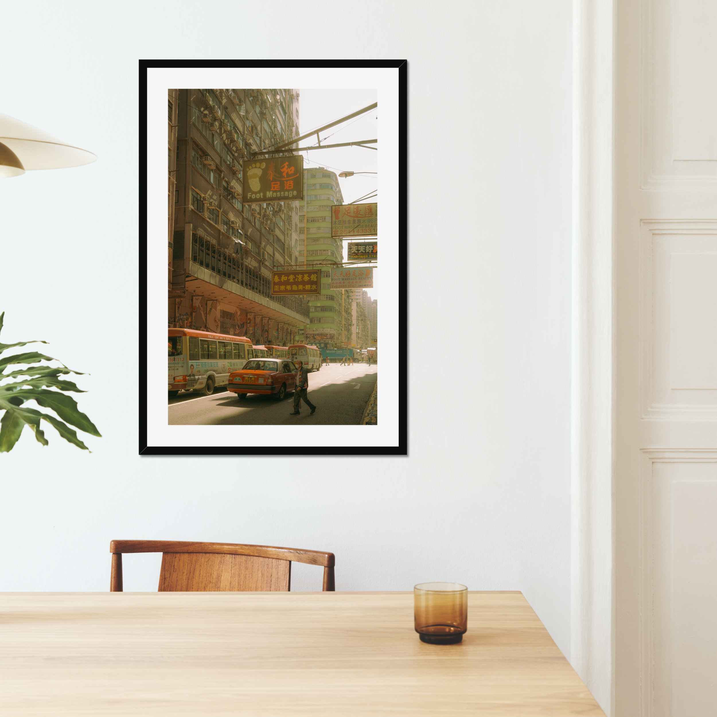 Sun-drenched Hong Kong street photography fine art print. Cinematic urban scene with vintage signs, a red taxi, and a solitary pedestrian crossing. Warm wall art decor.