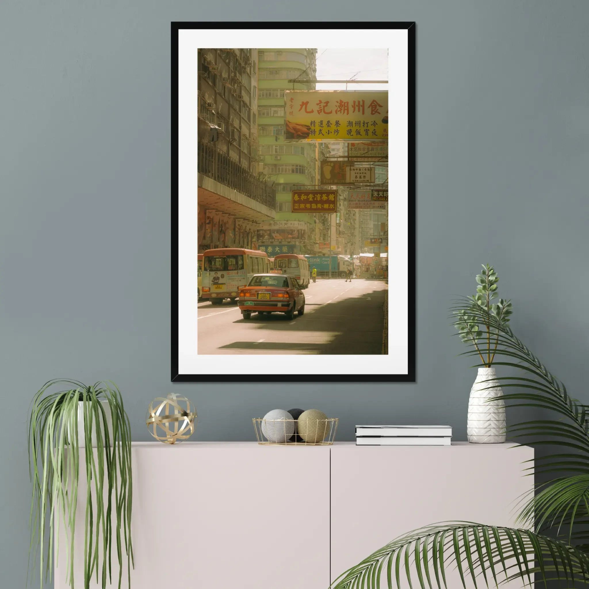 Sun-drenched Hong Kong street photography fine art print. Cinematic urban scene with a red taxi, minibuses, and layered vintage signs. Warm amber wall art decor.