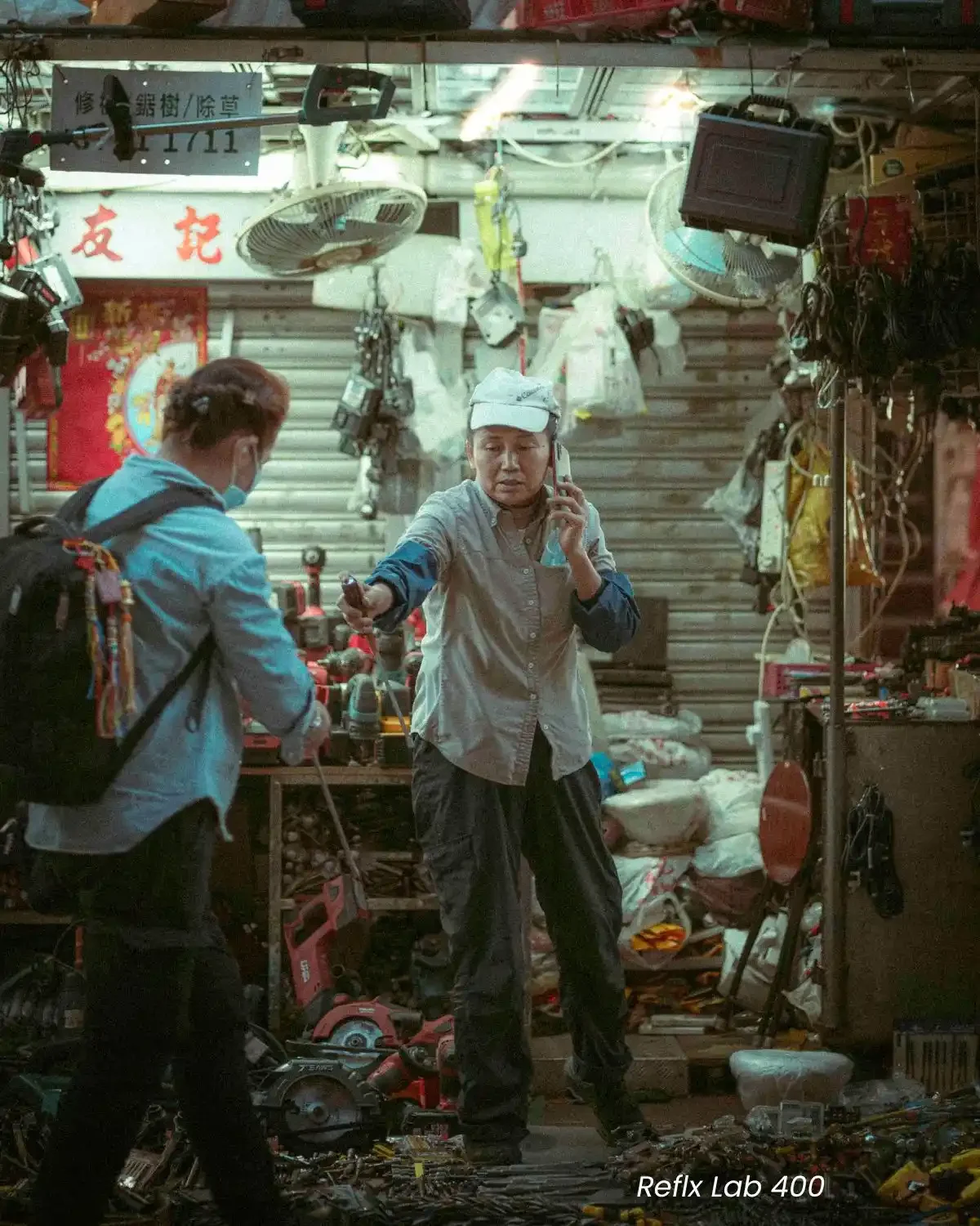 Comparison of Reflx Lab 800T and FilmNeverDies Suibo 500T film look presets on night street photography.