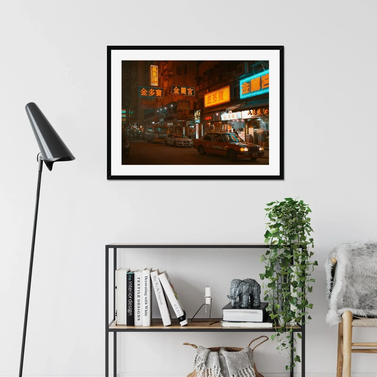 Night street photography of a red taxi in Mongkok, Hong Kong, surrounded by vibrant glowing neon signs and city lights.