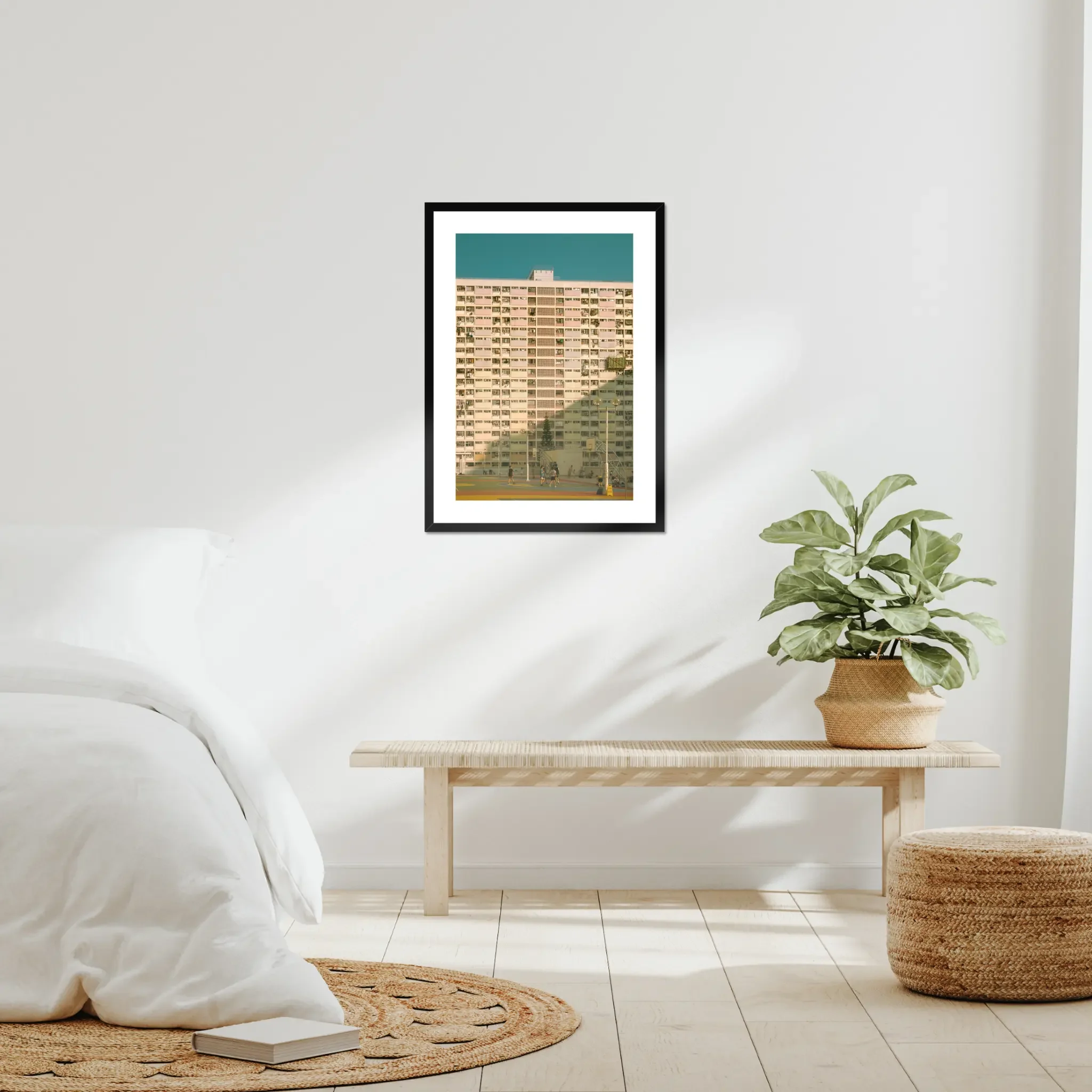 Vintage pastel building of Choi Hung Estate in Hong Kong with a colorful basketball court at golden hour.