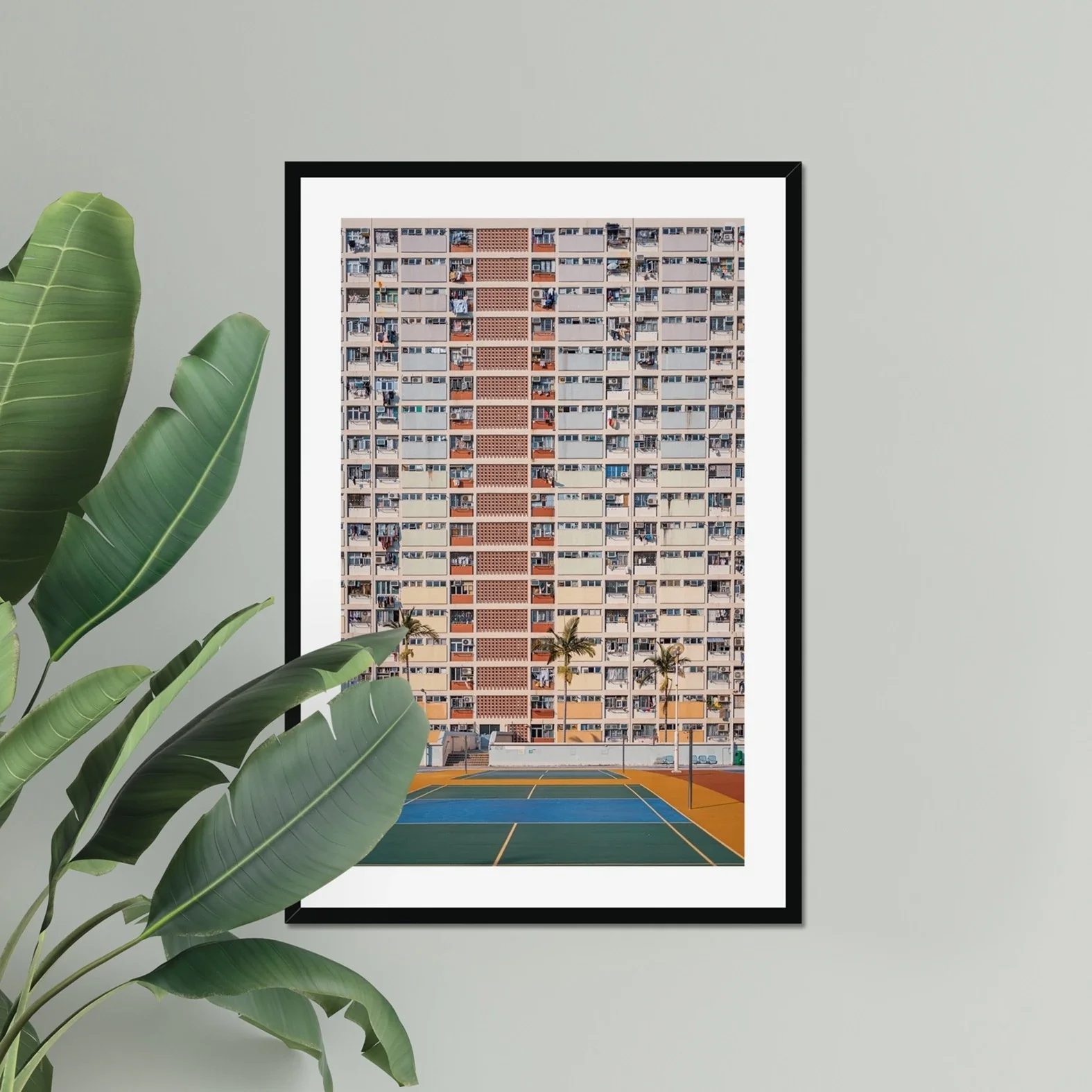 Professional architectural photography of the rainbow-colored Choi Hung Estate in Hong Kong, featuring the pastel building facade and basketball courts in the foreground.