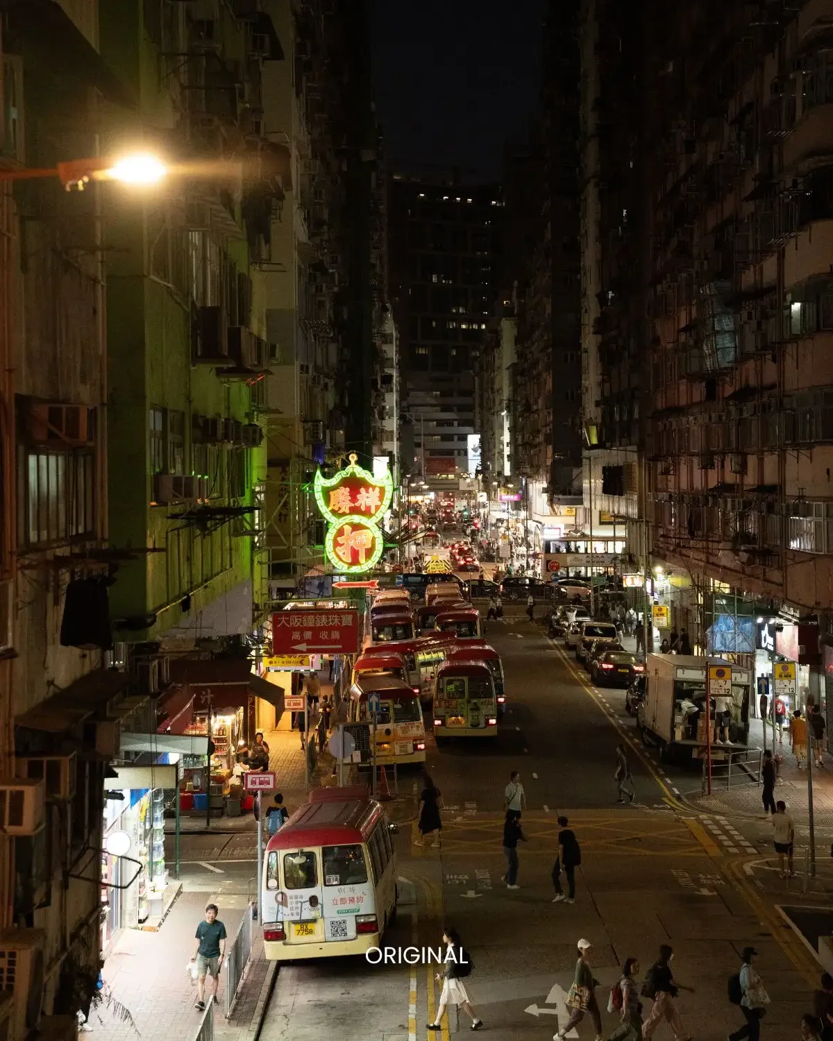 Neon Grunge preset on wide street lined with parked minibuses under warm night streetlight