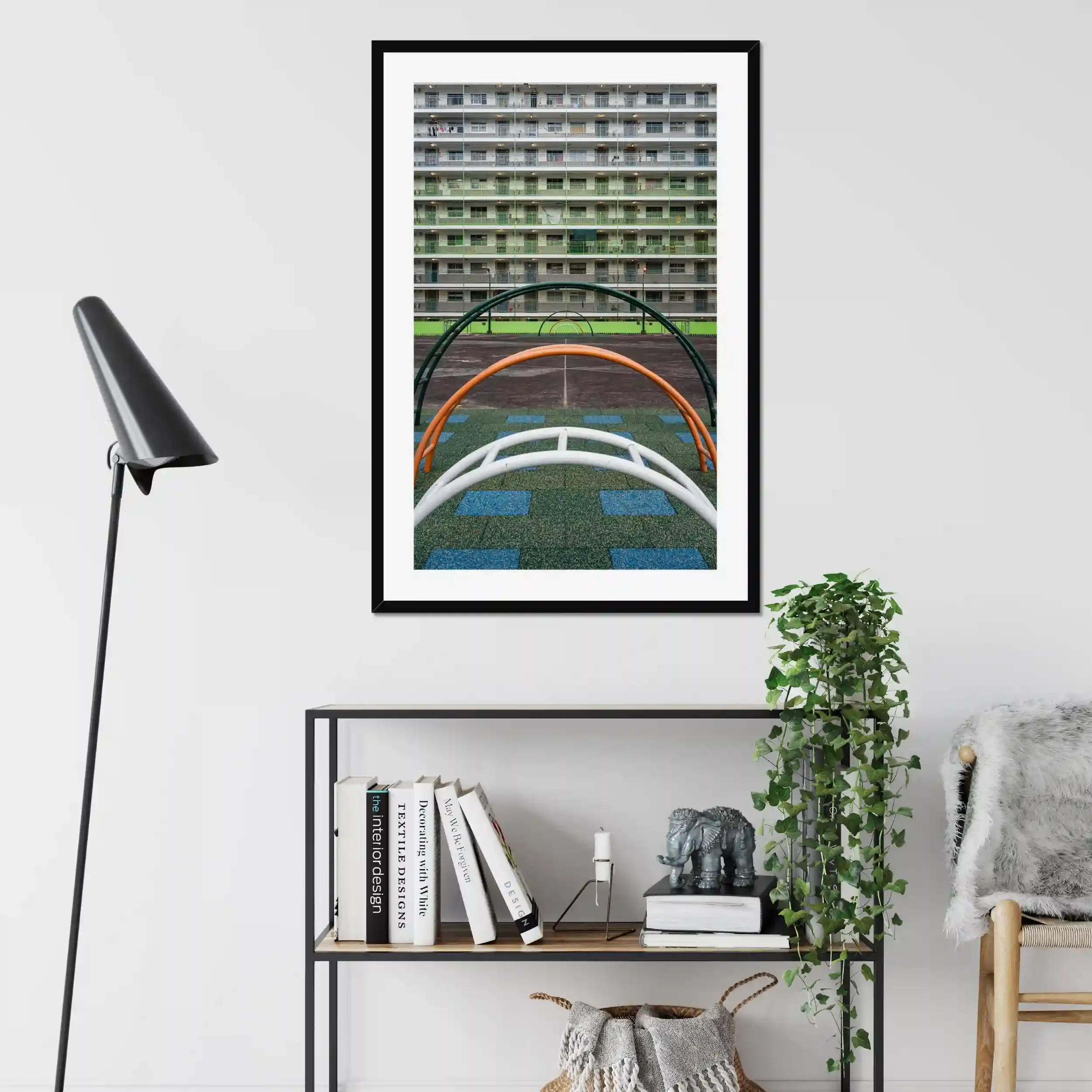 Symmetrical photography of the green residential buildings and the colorful courtyard playground at Nam Shan Estate in Hong Kong.