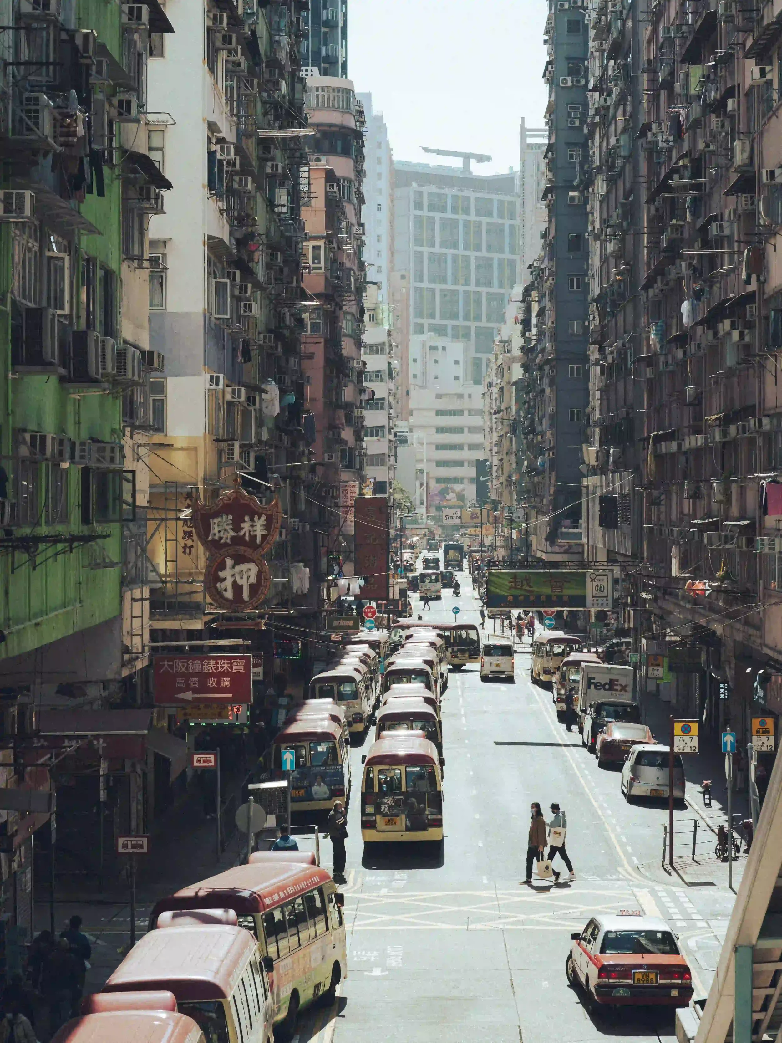 Before and after comparison of a sunlit portrait and street scene edited with the Kodak Portra 400 Lightroom preset, showing warm skin tones and 35mm film emulation by ejduranphotography
