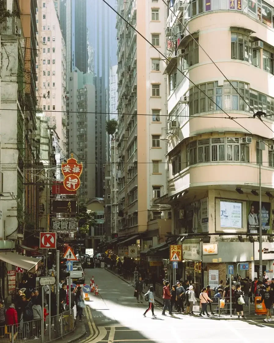 Before and after comparison of Kodak Pro 100 Lightroom preset showing soft contrast and warm film tones on a daylight portrait.