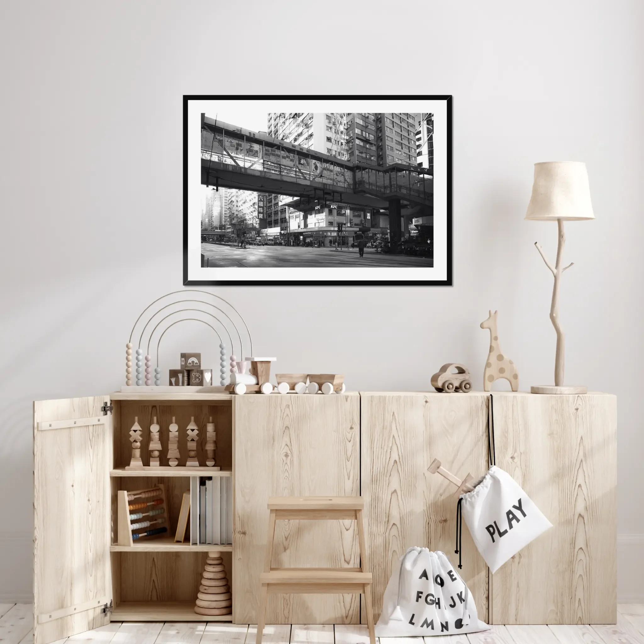 Black and white street photography print of a solitary figure walking through a narrow Hong Kong alley in a dramatic shaft of light. High-contrast cinematic Noir fine art wall decor.