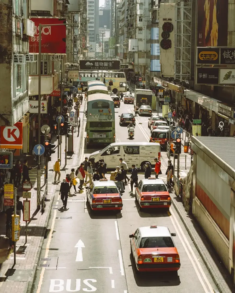 Before and after comparison of Kodak Pro 100 Lightroom preset showing soft contrast and warm film tones on a daylight portrait.