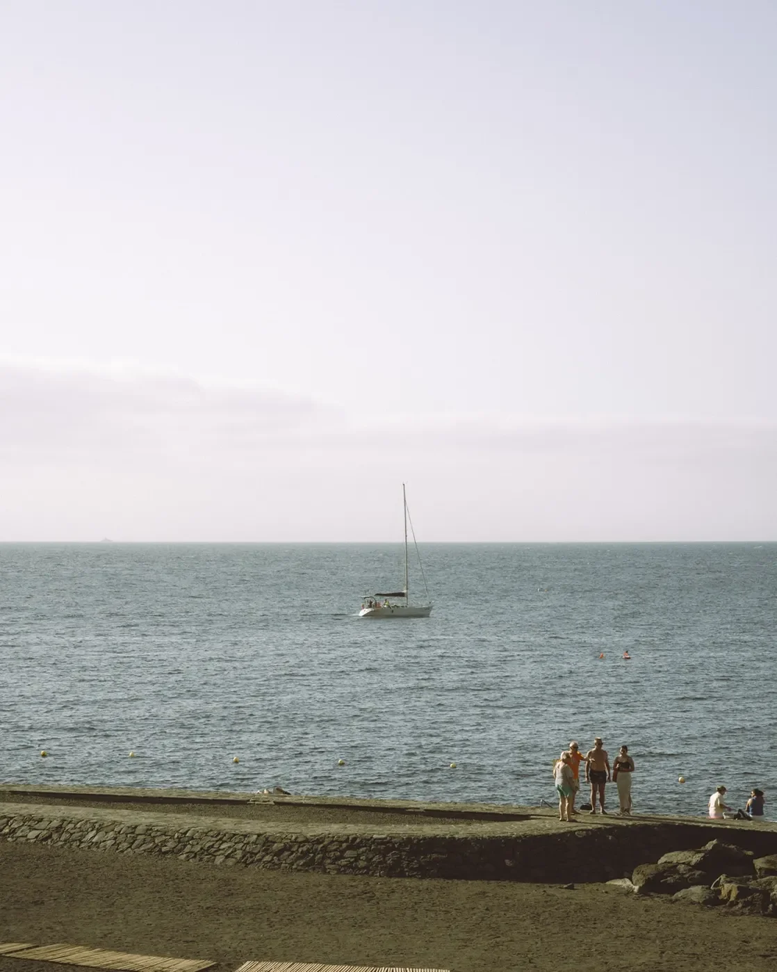 Before and after comparison of Kodak Pro 100 Lightroom preset showing soft contrast and warm film tones on a daylight portrait.
