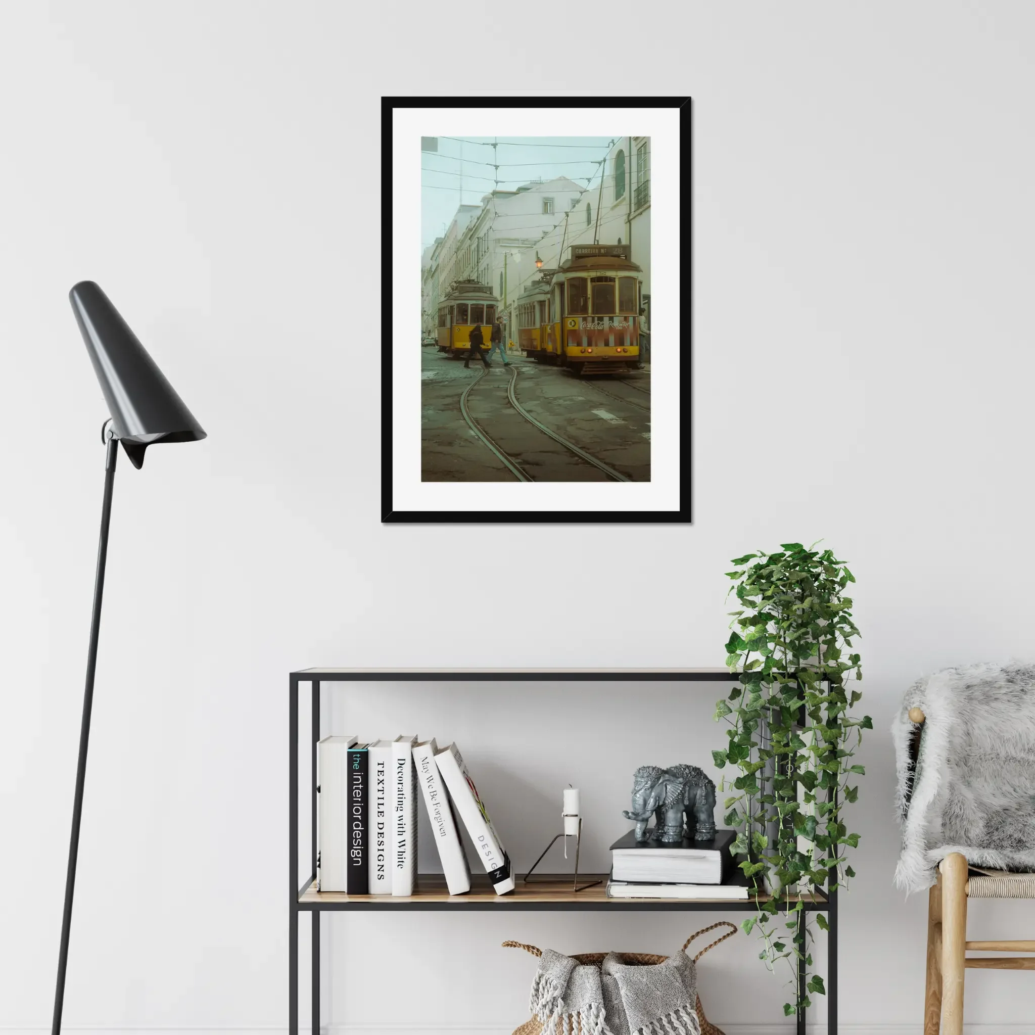 Cinematic fine art photography of Lisbon yellow Tram 28 and anonymous couple crossing tracks in moody morning fog.