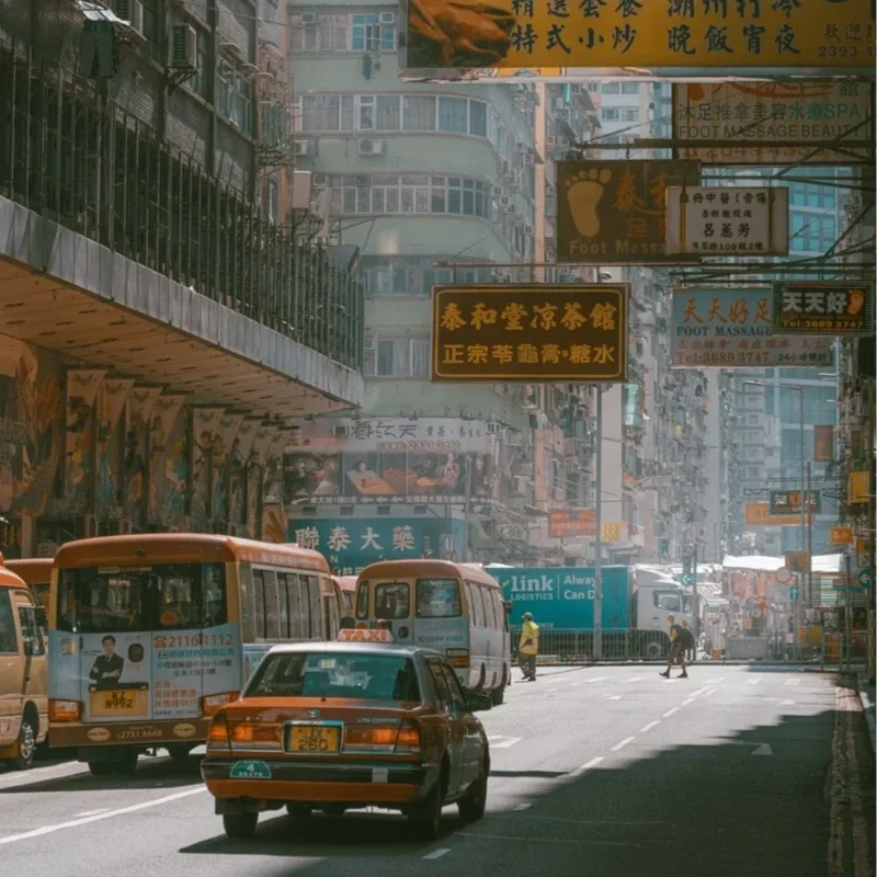 Golden morning sunlight on Mongkok street with vintage film look. Nostalgic art.