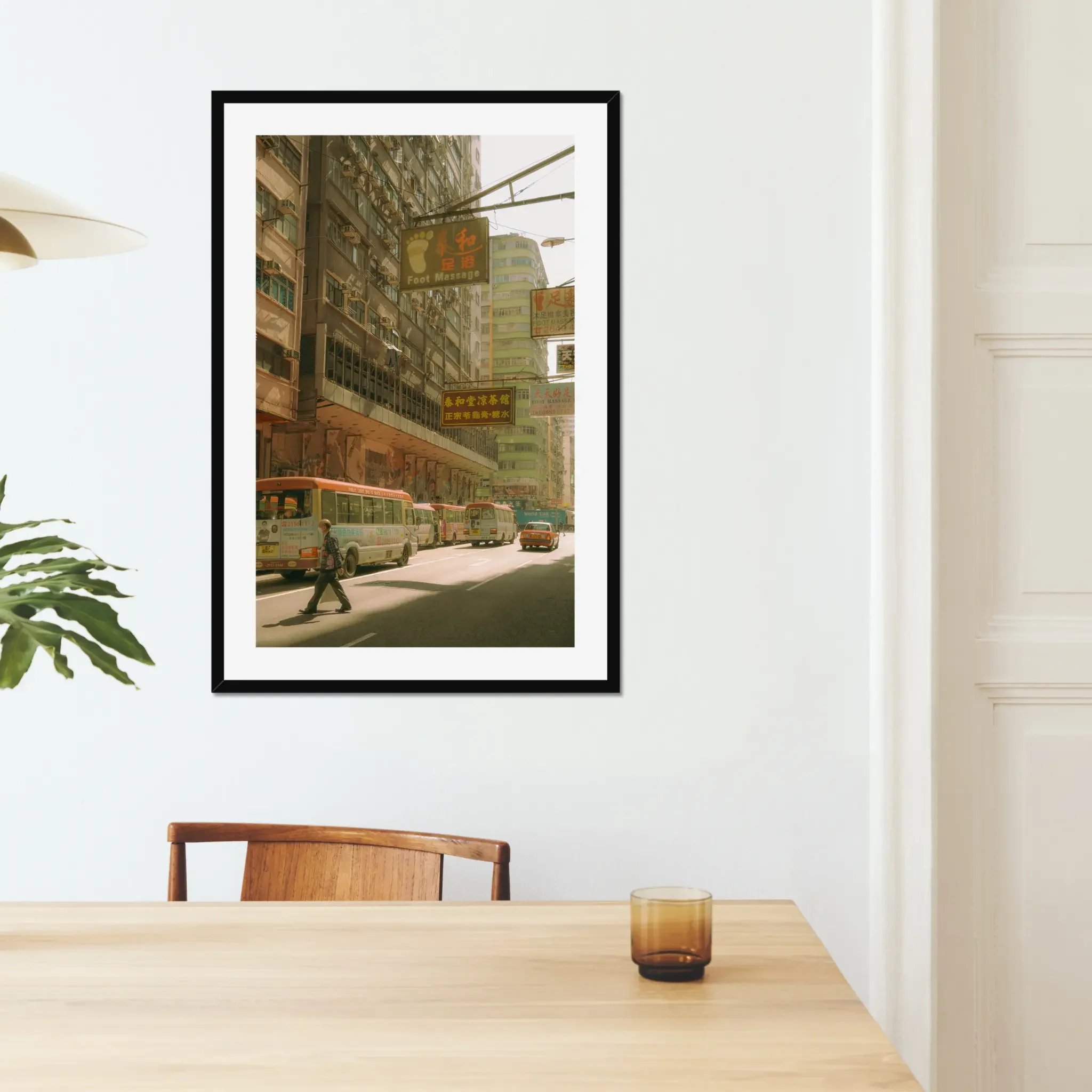 Sun-drenched Hong Kong street photography fine art print. Cinematic urban scene with red-topped minibuses, a red taxi, vintage signs, and a pedestrian crossing. Warm amber wall art decor.