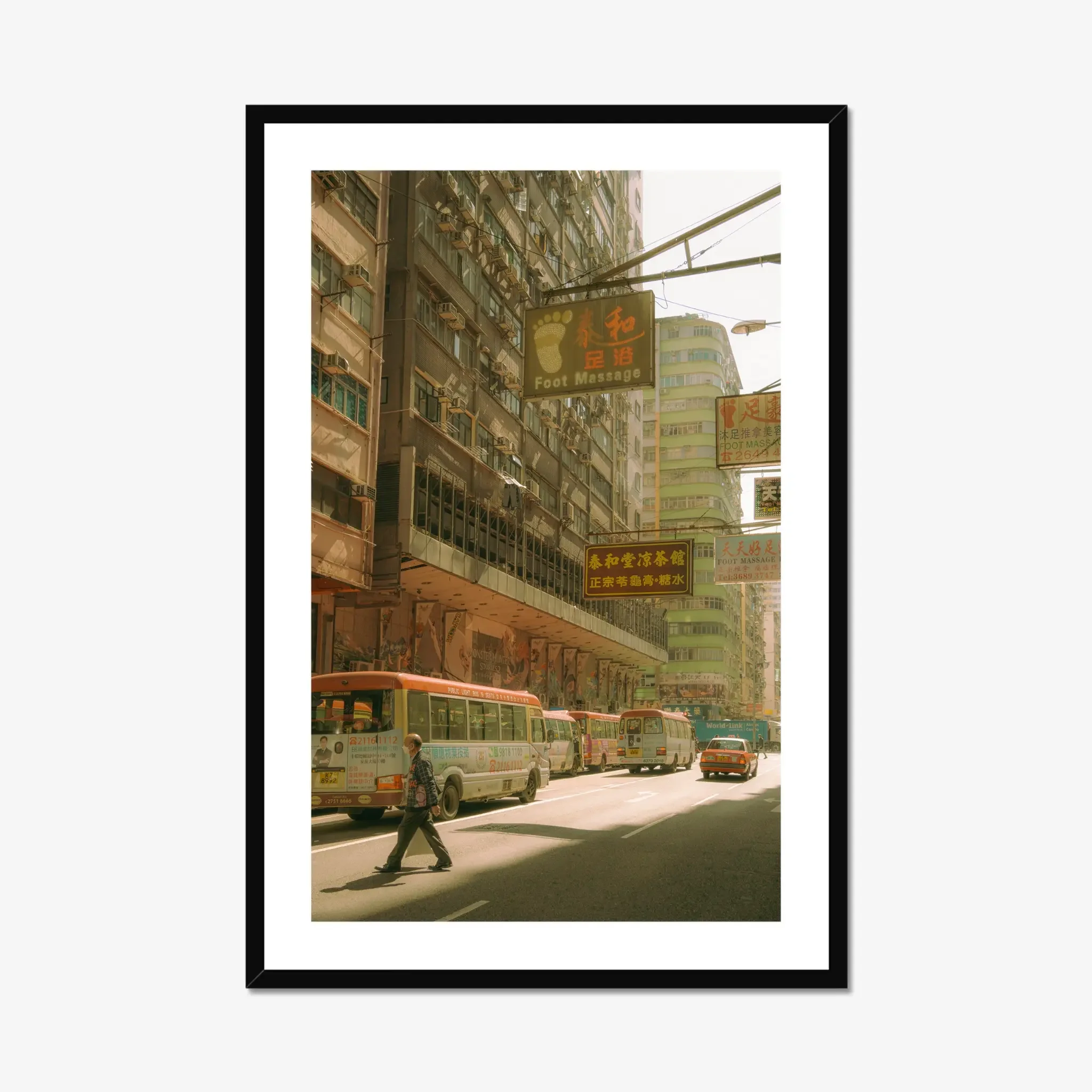 Sun-drenched Hong Kong street photography fine art print. Cinematic urban scene with red-topped minibuses, a red taxi, vintage signs, and a pedestrian crossing. Warm amber wall art decor.