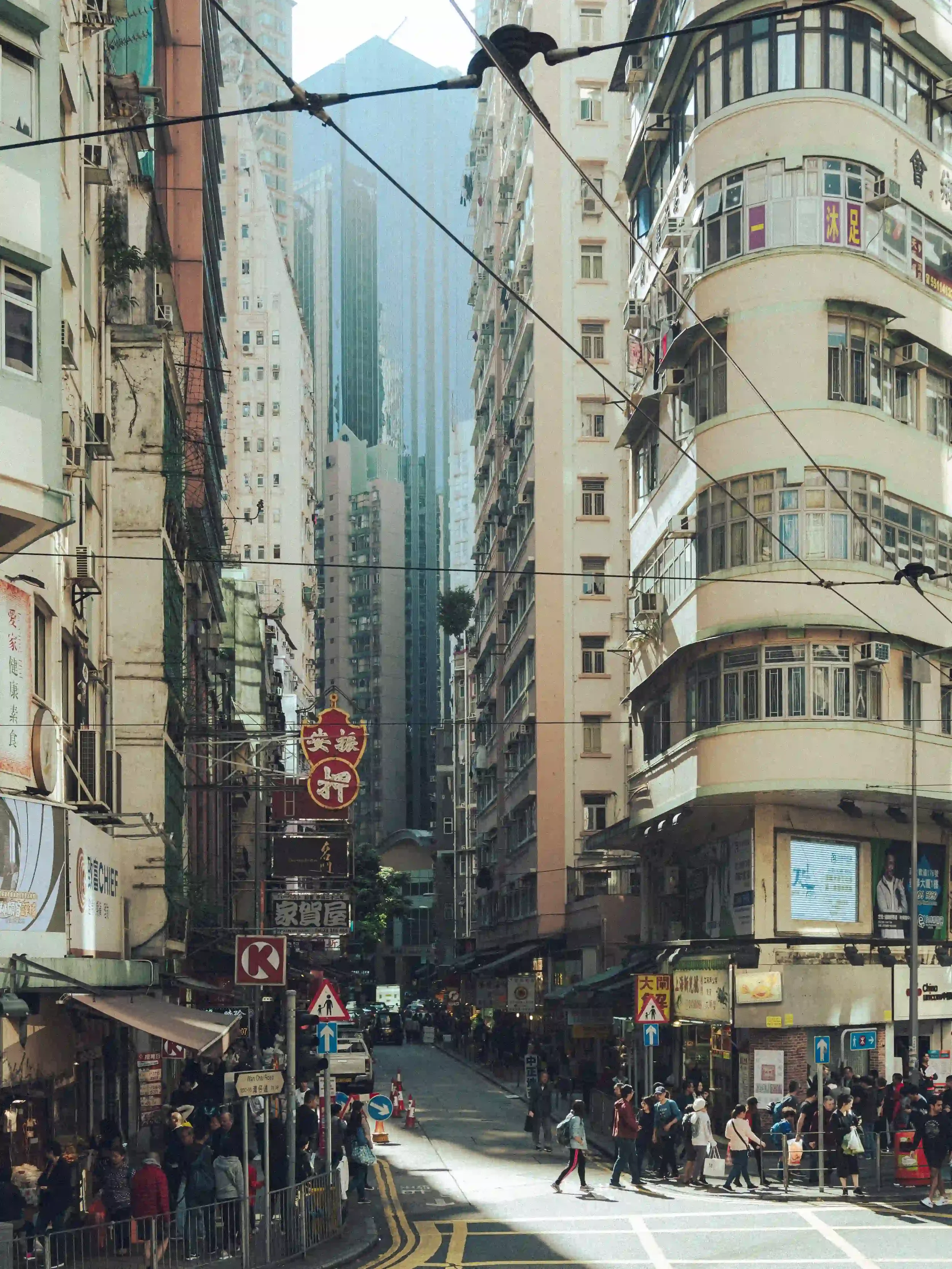 Before and after comparison of a sunlit portrait and street scene edited with the Kodak Portra 400 Lightroom preset, showing warm skin tones and 35mm film emulation by ejduranphotography