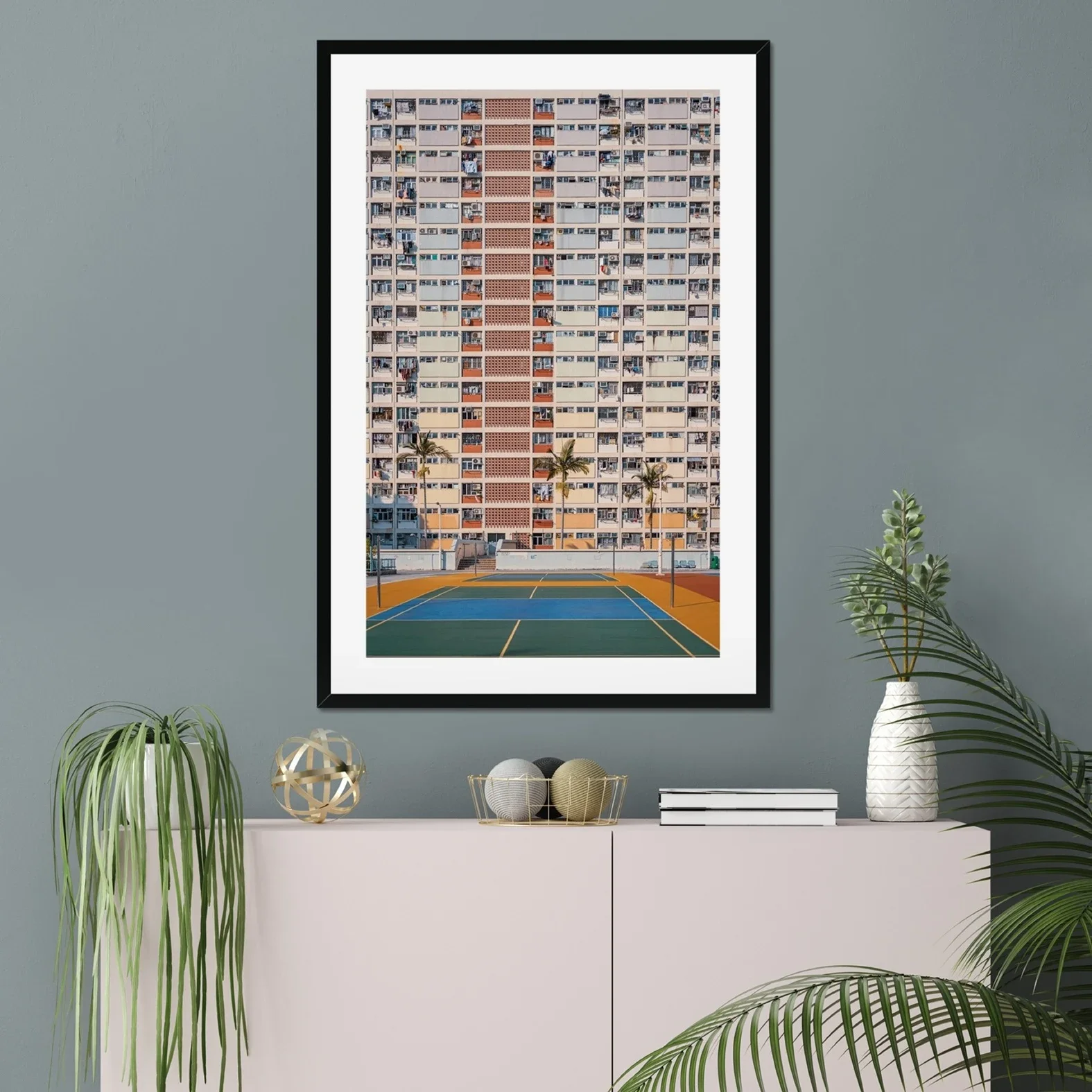 Professional architectural photography of the rainbow-colored Choi Hung Estate in Hong Kong, featuring the pastel building facade and basketball courts in the foreground.