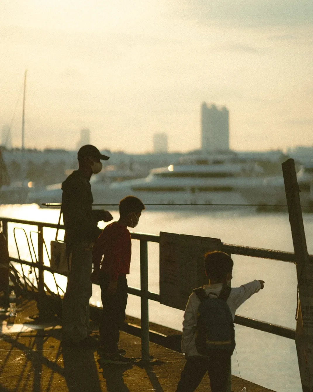 Before and after comparison using Lomography 800 Lightroom preset on a night street photography scene with vibrant neon lights and film grain.