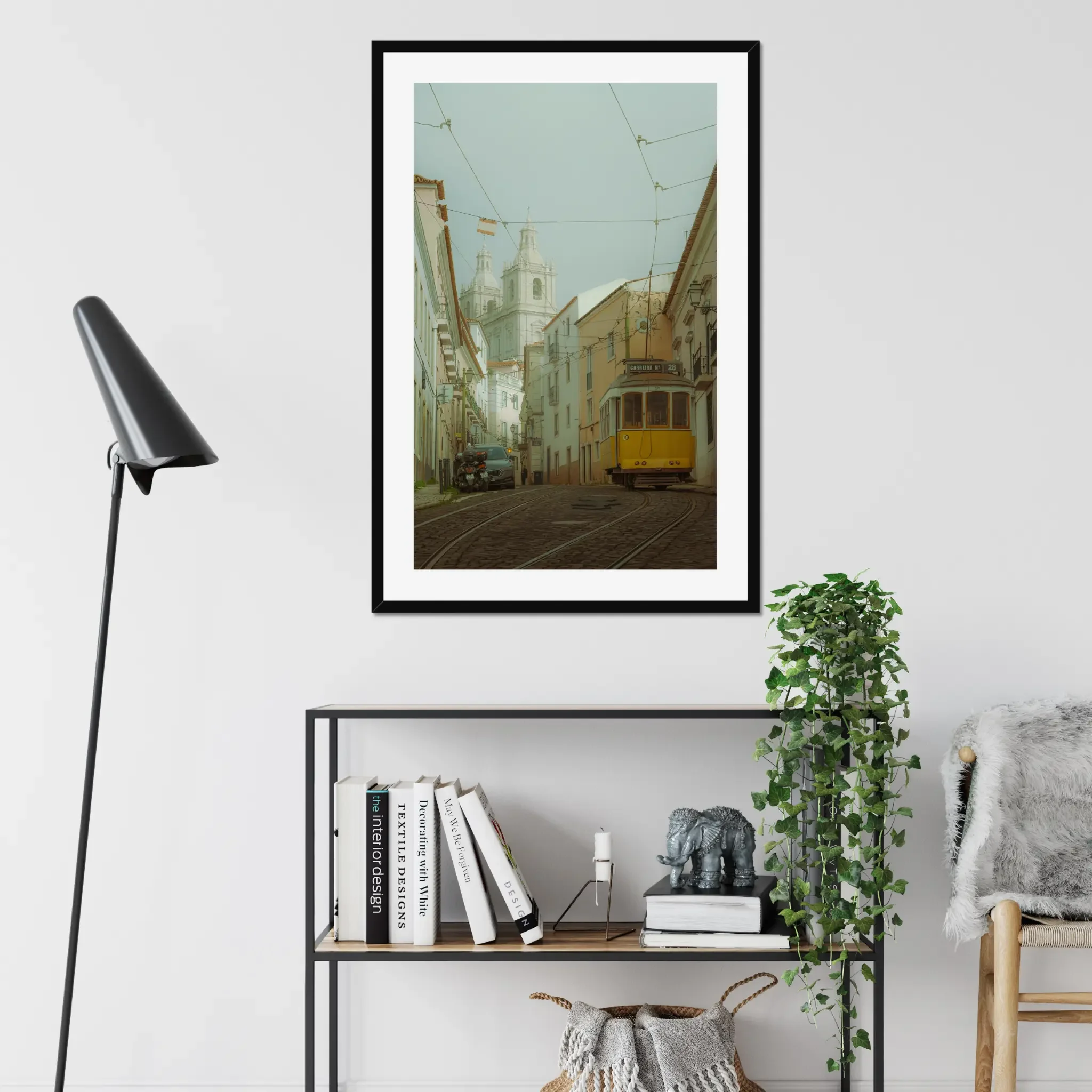 ejduranphotography Fine Art Lisbon print. Cinematic street photography of the iconic yellow Tram 28 on a winding cobblestone street with a misty church background. Moody wall art decor.