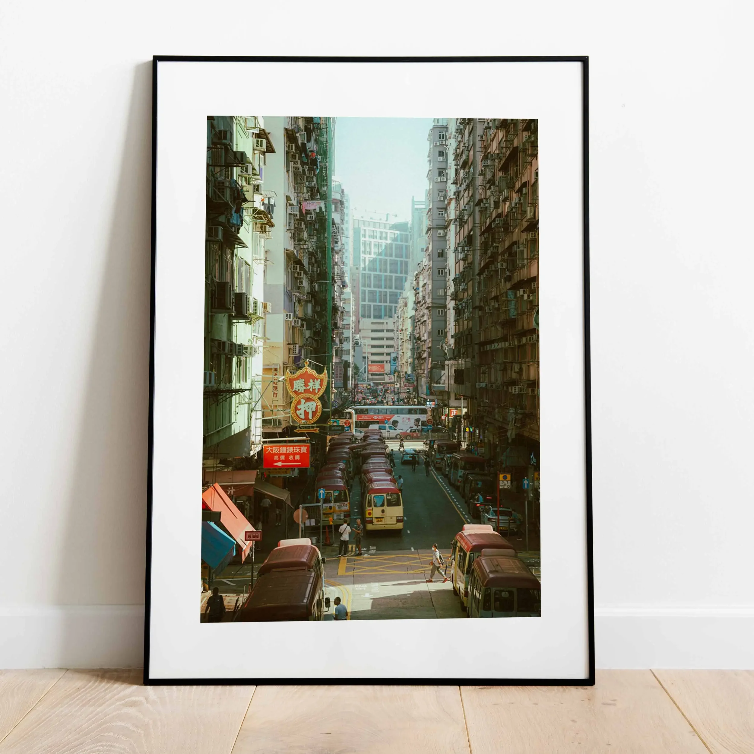 Vintage style street photography of Mong Kok Hong Kong at sunset, golden hour light over minibus stops and city traffic, nostalgic 1980s urban aesthetic, cinematic retro wall art print.
