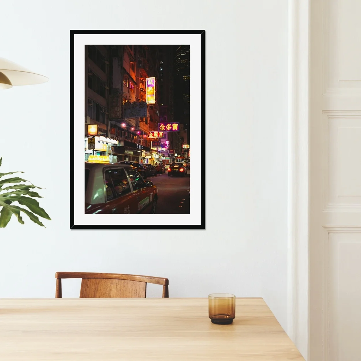 Cinematic night photography of a red taxi in Mong Kok Hong Kong, neon signs reflections on wet street, CineStill 50D film aesthetic, urban street documentary art.