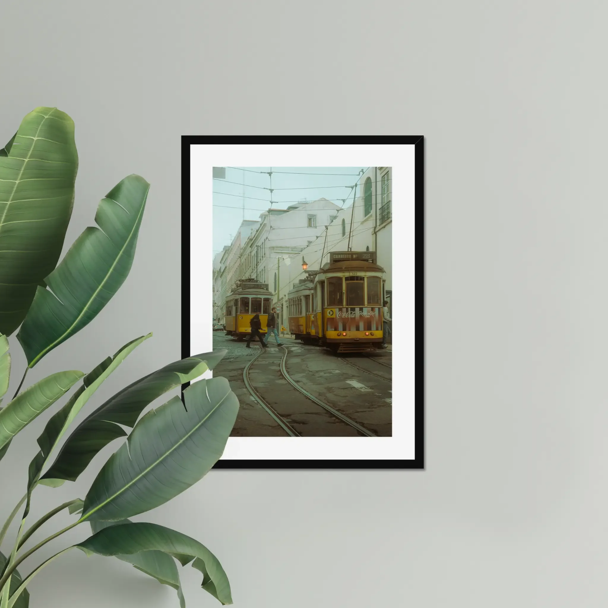 Cinematic fine art photography of Lisbon yellow Tram 28 and anonymous couple crossing tracks in moody morning fog.
