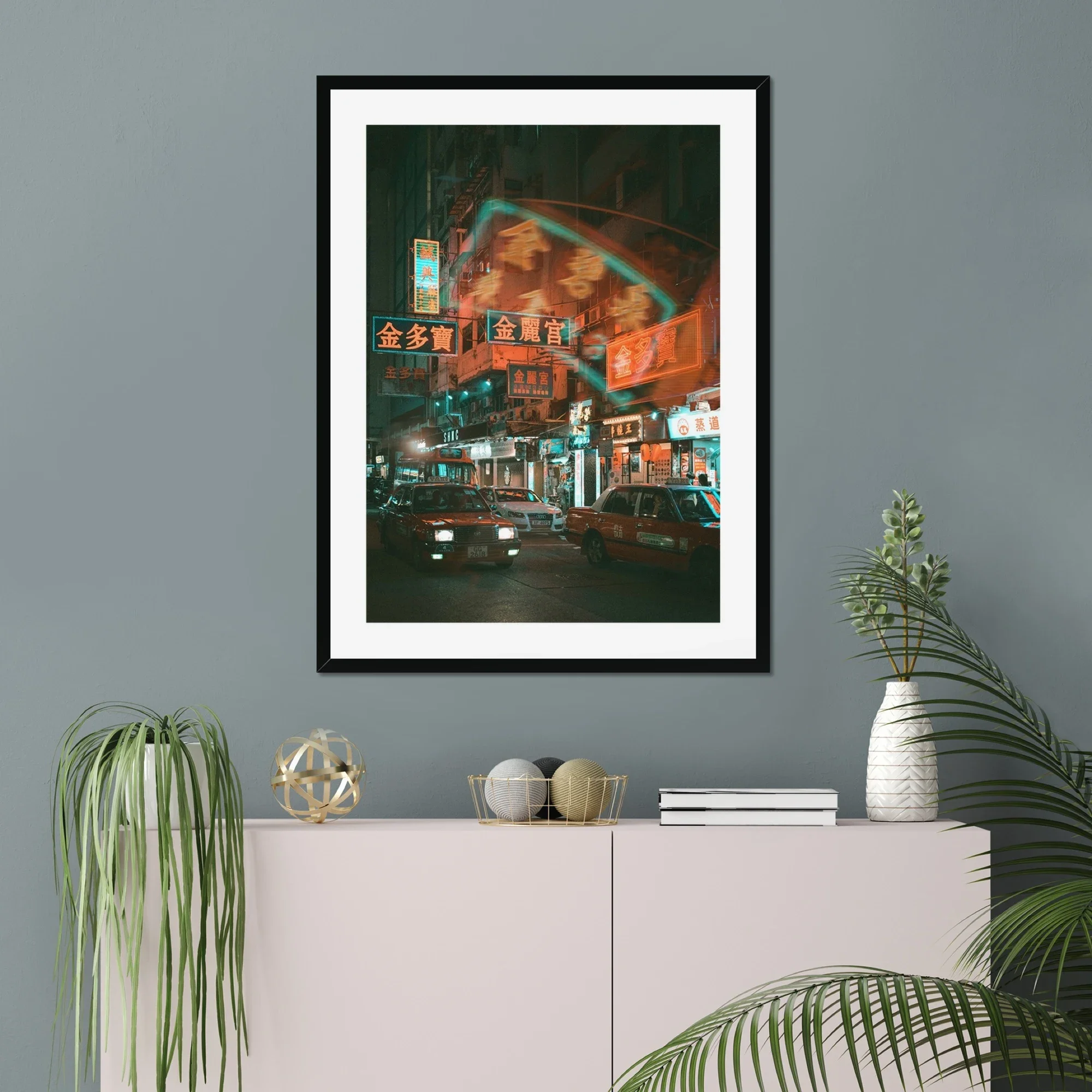 Professional night photography of a red taxi driving through Mong Kok, Hong Kong, with vibrant neon signs and reflections on the wet street.