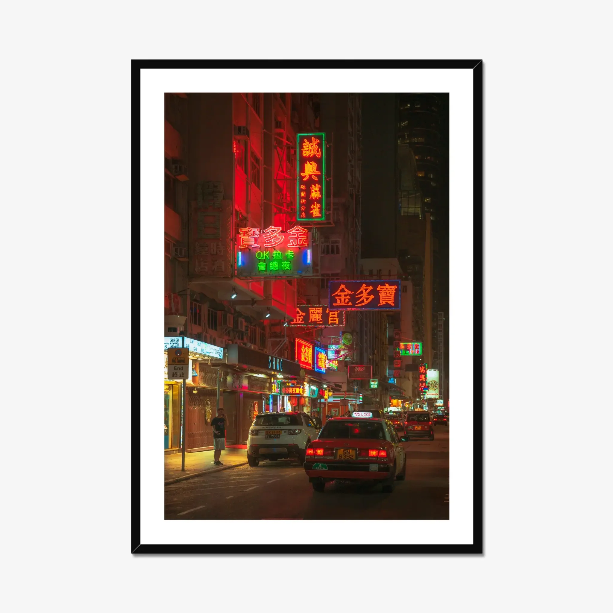 Mong Kok street photography print showing neon signage and a solitary figure at night in Hong Kong