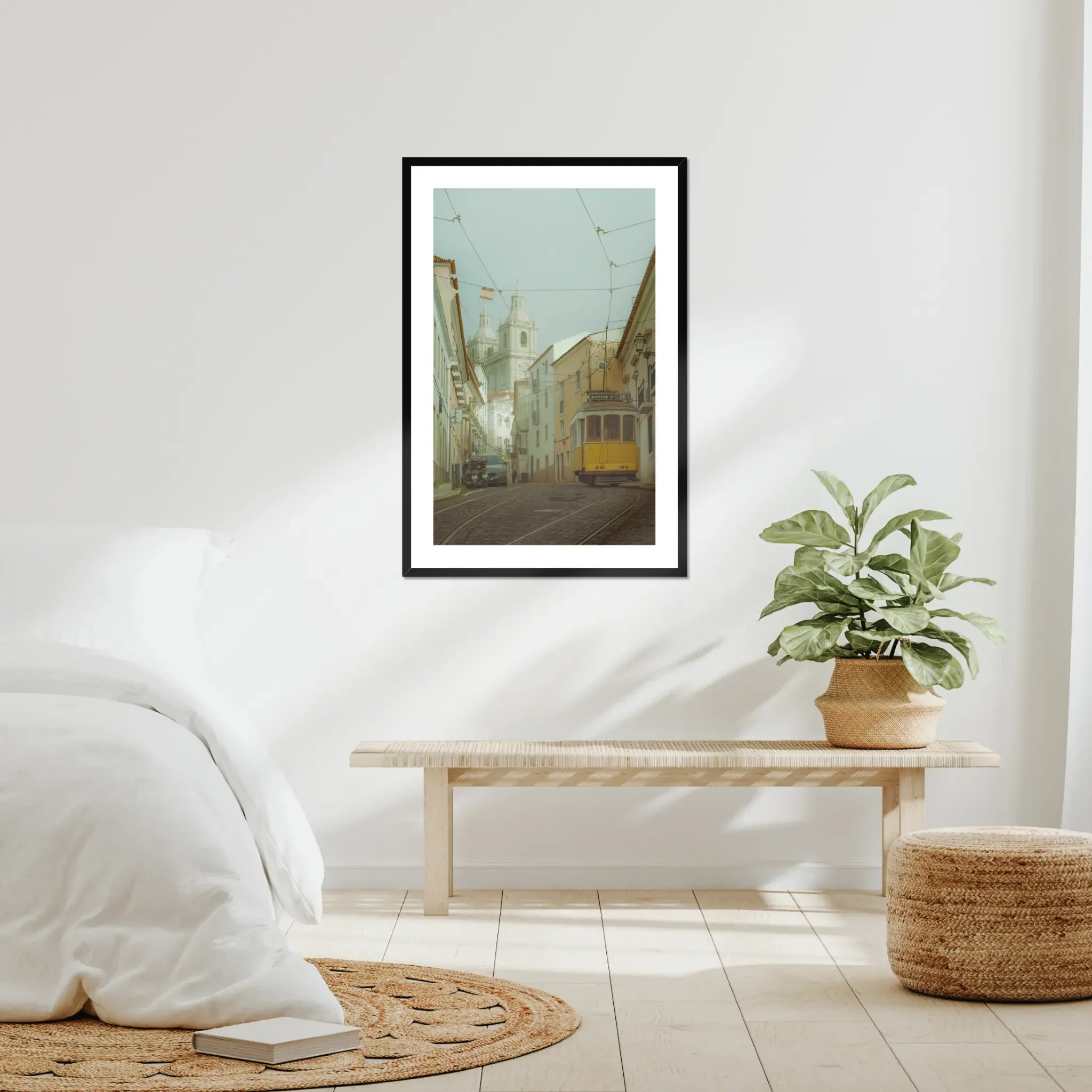 ejduranphotography Fine Art Lisbon print. Cinematic street photography of the iconic yellow Tram 28 on a winding cobblestone street with a misty church background. Moody wall art decor.
