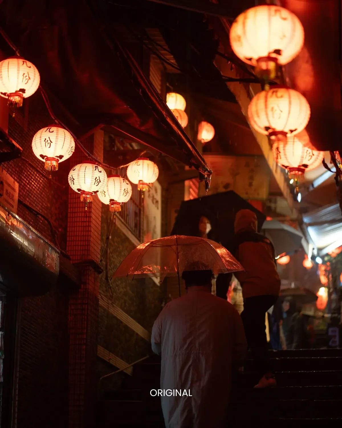 Neon Grunge preset on red paper lanterns over rainy street with pedestrians holding umbrellas