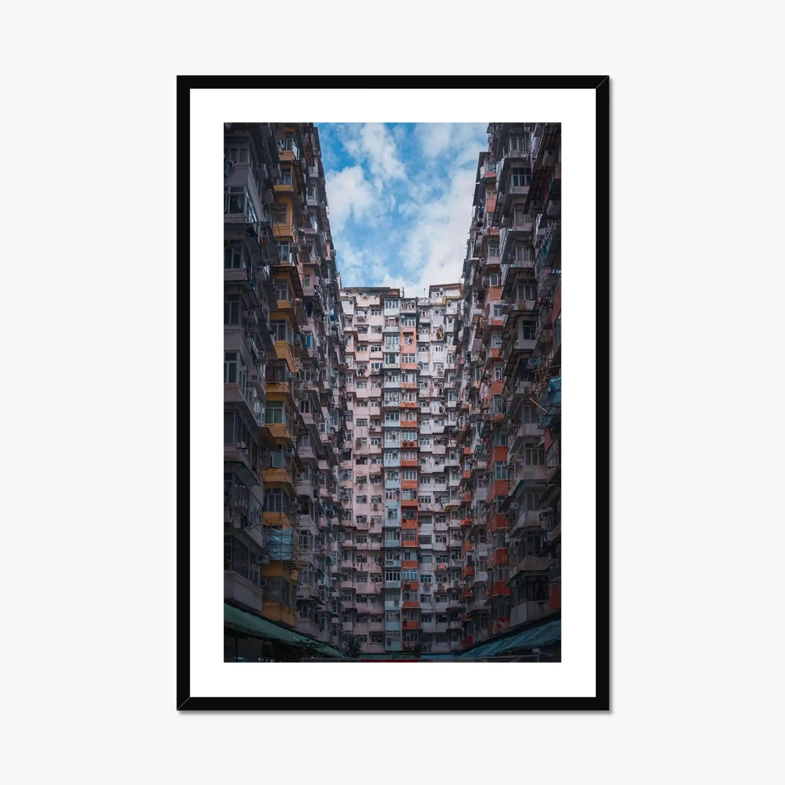 Symmetrical wide-angle photography of the massive Monster Building residential complex in Quarry Bay, Hong Kong.