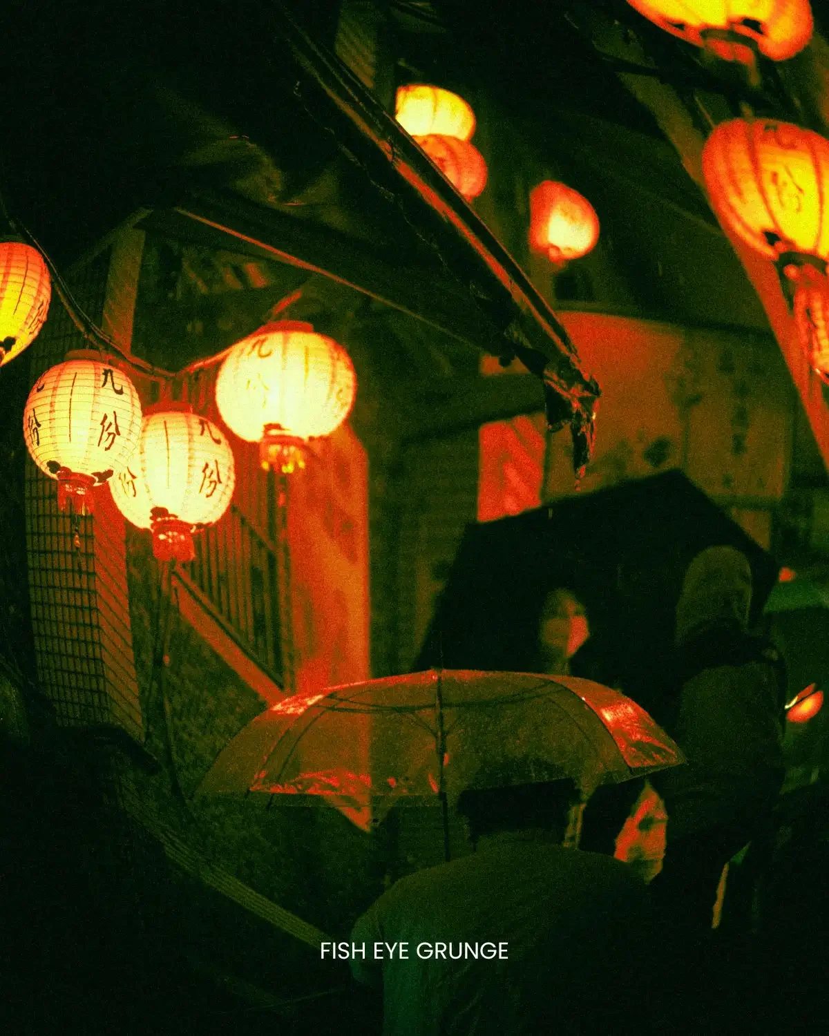 Neon Grunge preset close-up of red paper lanterns glowing warm against dark green night background