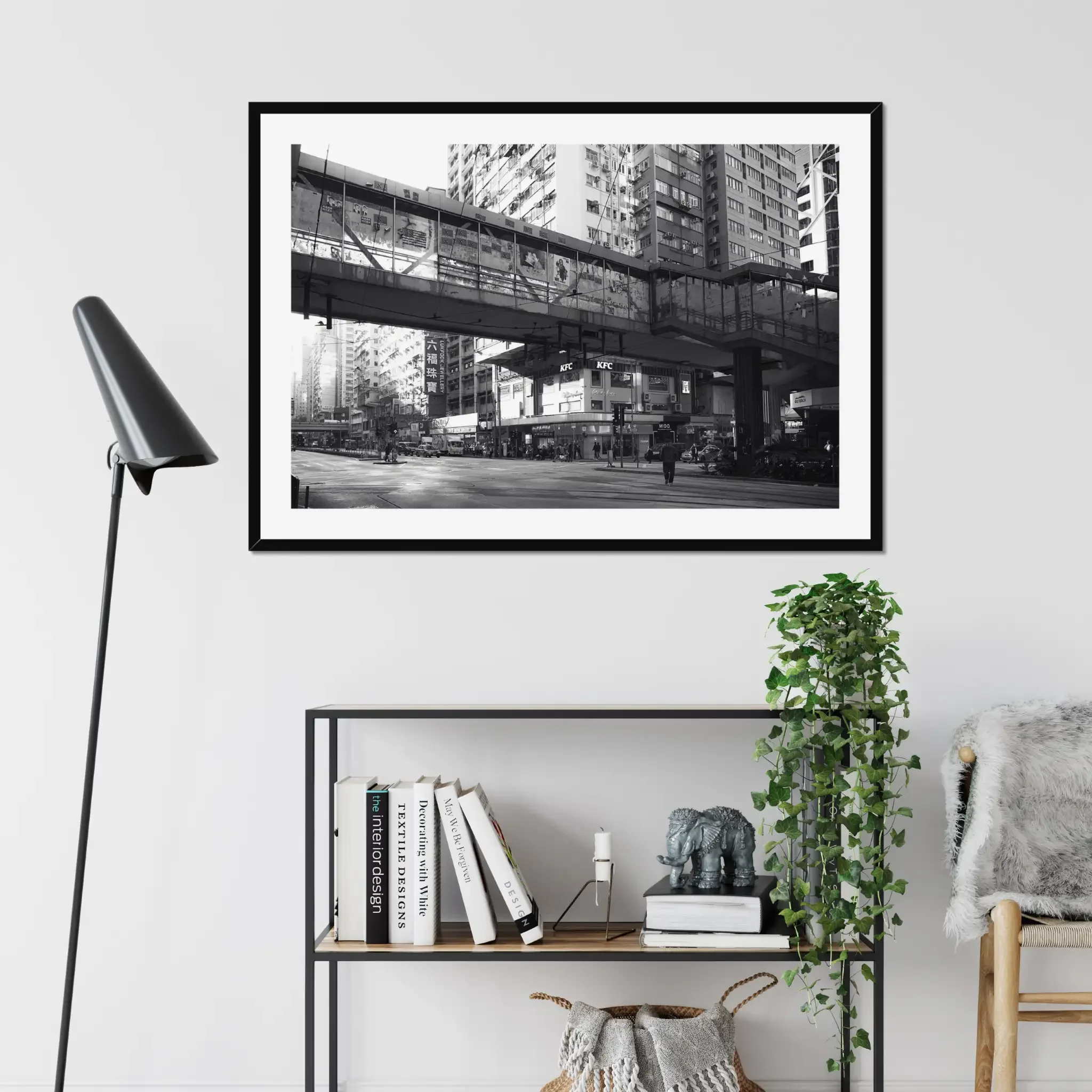 Black and white street photography print of a solitary figure walking through a narrow Hong Kong alley in a dramatic shaft of light. High-contrast cinematic Noir fine art wall decor.