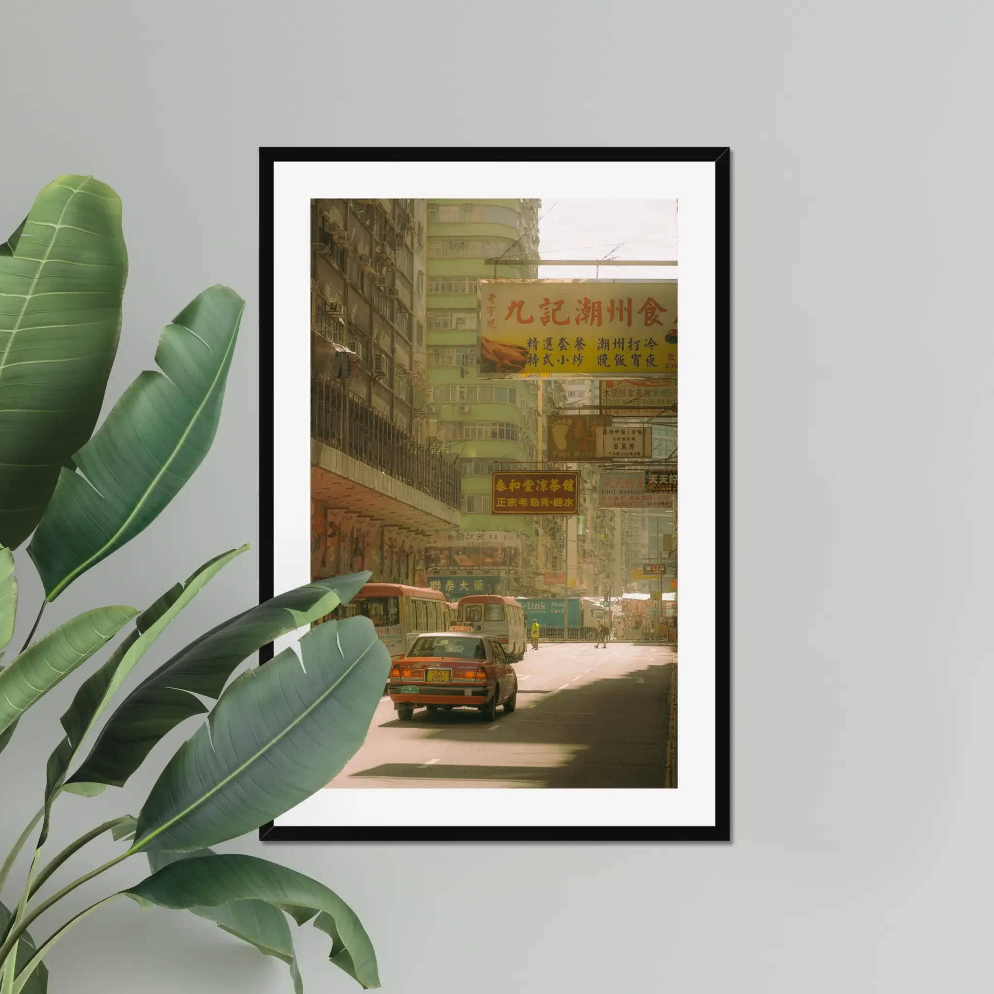 Sun-drenched Hong Kong street photography fine art print. Cinematic urban scene with a red taxi, minibuses, and layered vintage signs. Warm amber wall art decor.