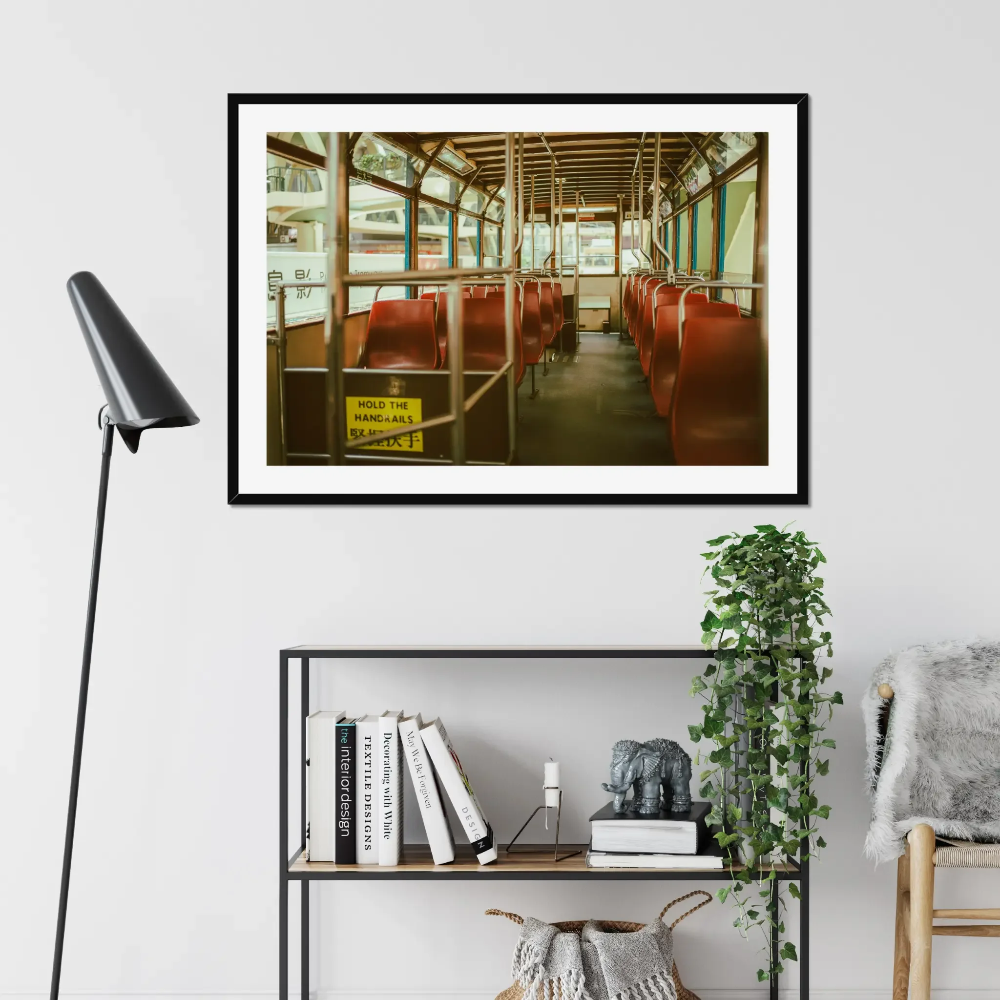 Vintage Hong Kong tram interior fine art print featuring red seats and a hold the handrails sign in warm cinematic tones.