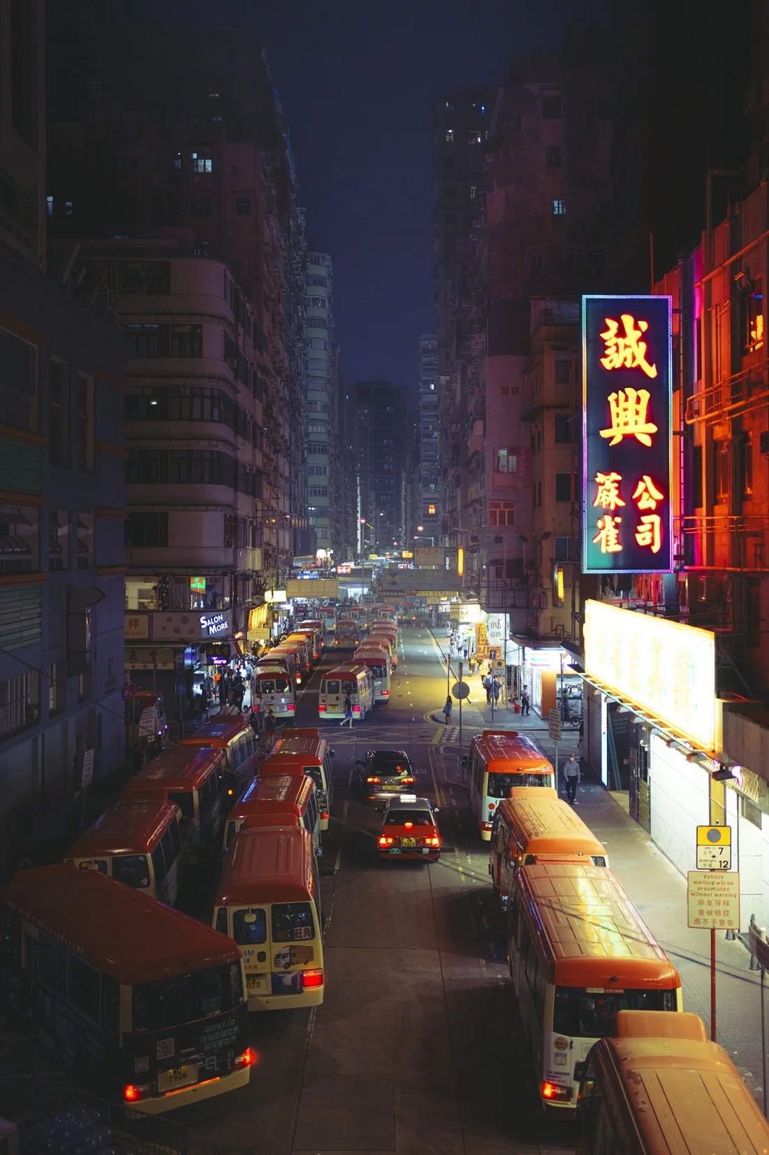 hong-kong-street-photography-neon-signs-cinematic-retro-Cinestill-vintage-taxi-minibus-urban-night-ejduranphotography.jpg