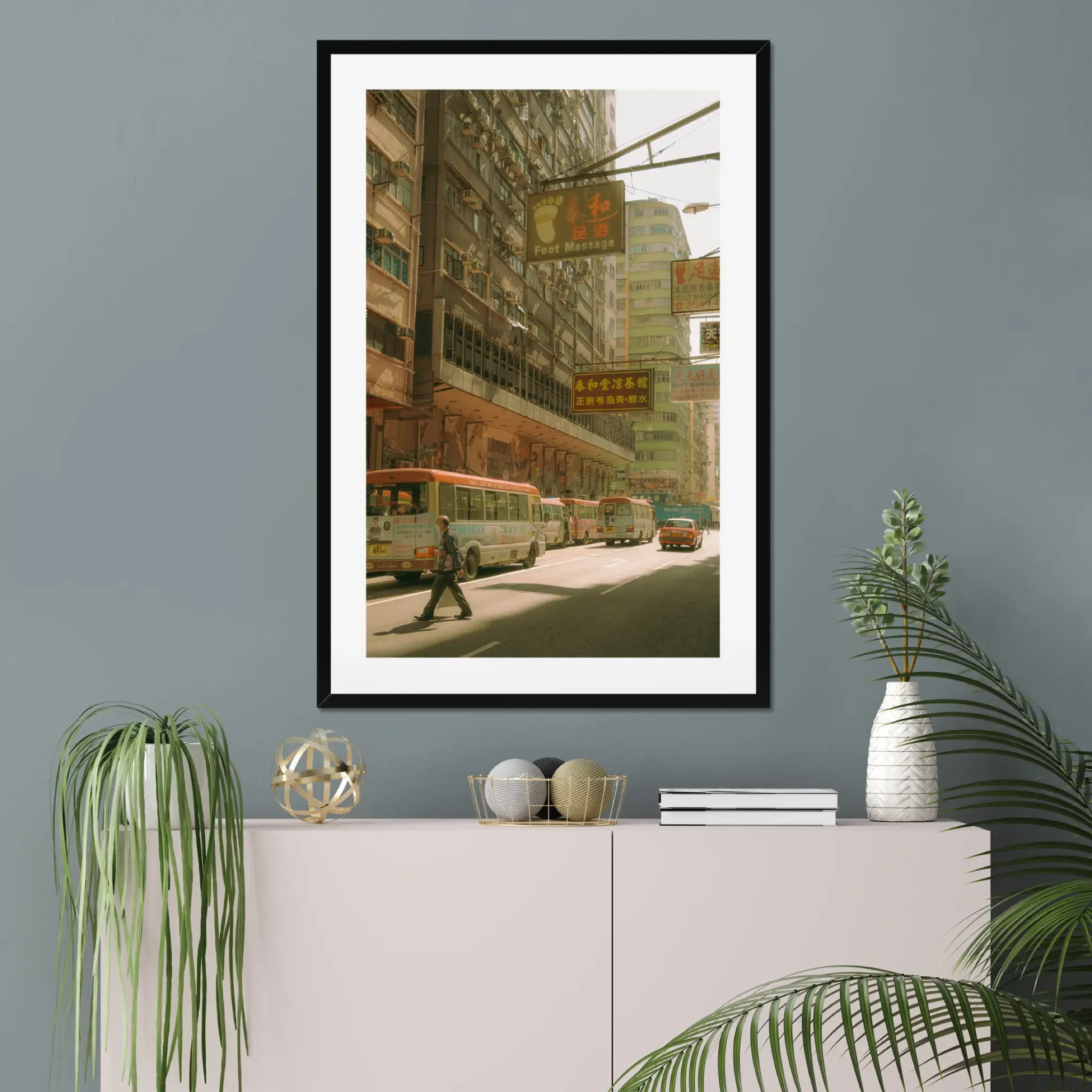 Sun-drenched Hong Kong street photography fine art print. Cinematic urban scene with red-topped minibuses, a red taxi, vintage signs, and a pedestrian crossing. Warm amber wall art decor.