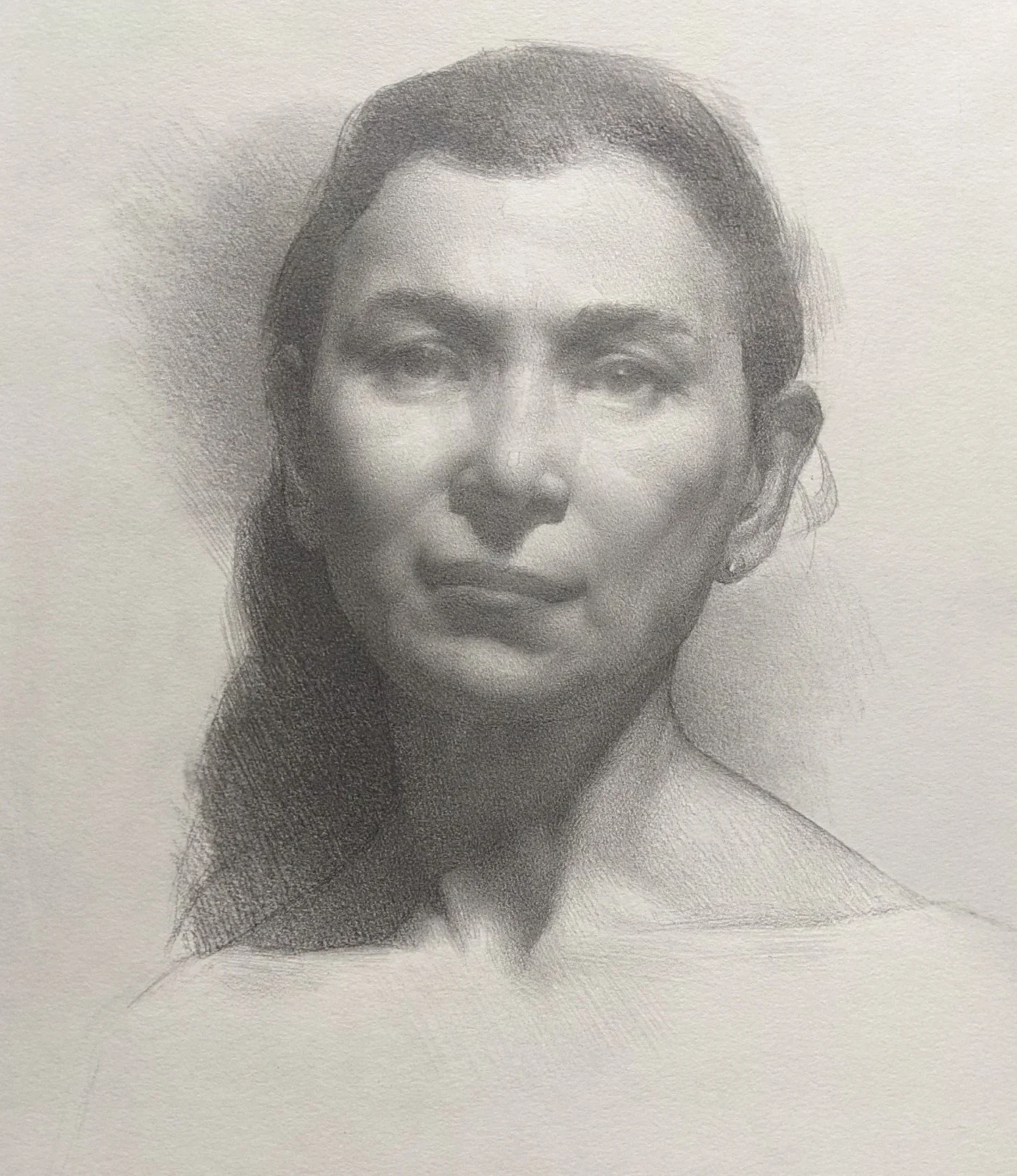 A grayscale portrait of a woman with long hair, detailed shading, and realistic features.