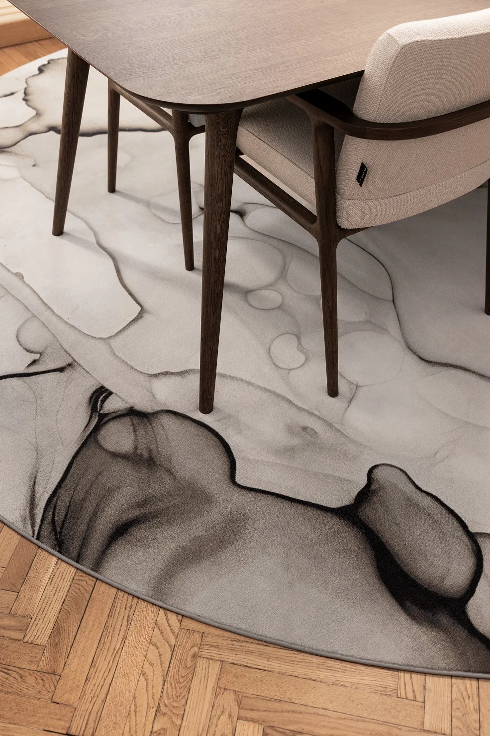 Modern dining room with a carpet with a pattern of Dibble Dabble Lake by Moooi Carpets, pattern design and illustration project by Automne Studio.
