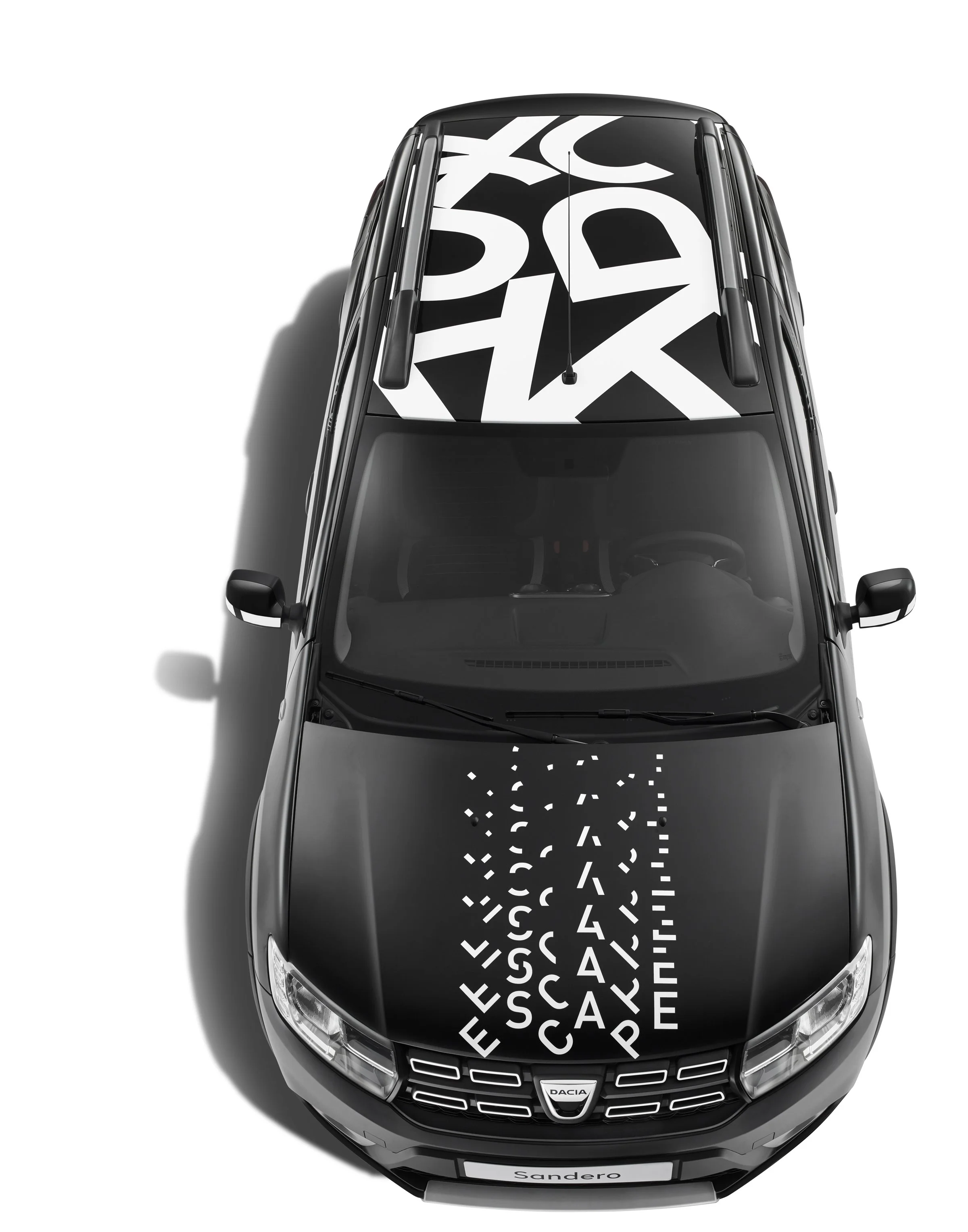 Top-down view of a black Dacia Sandero Escape Limited Edition, typography by Automne Studio.