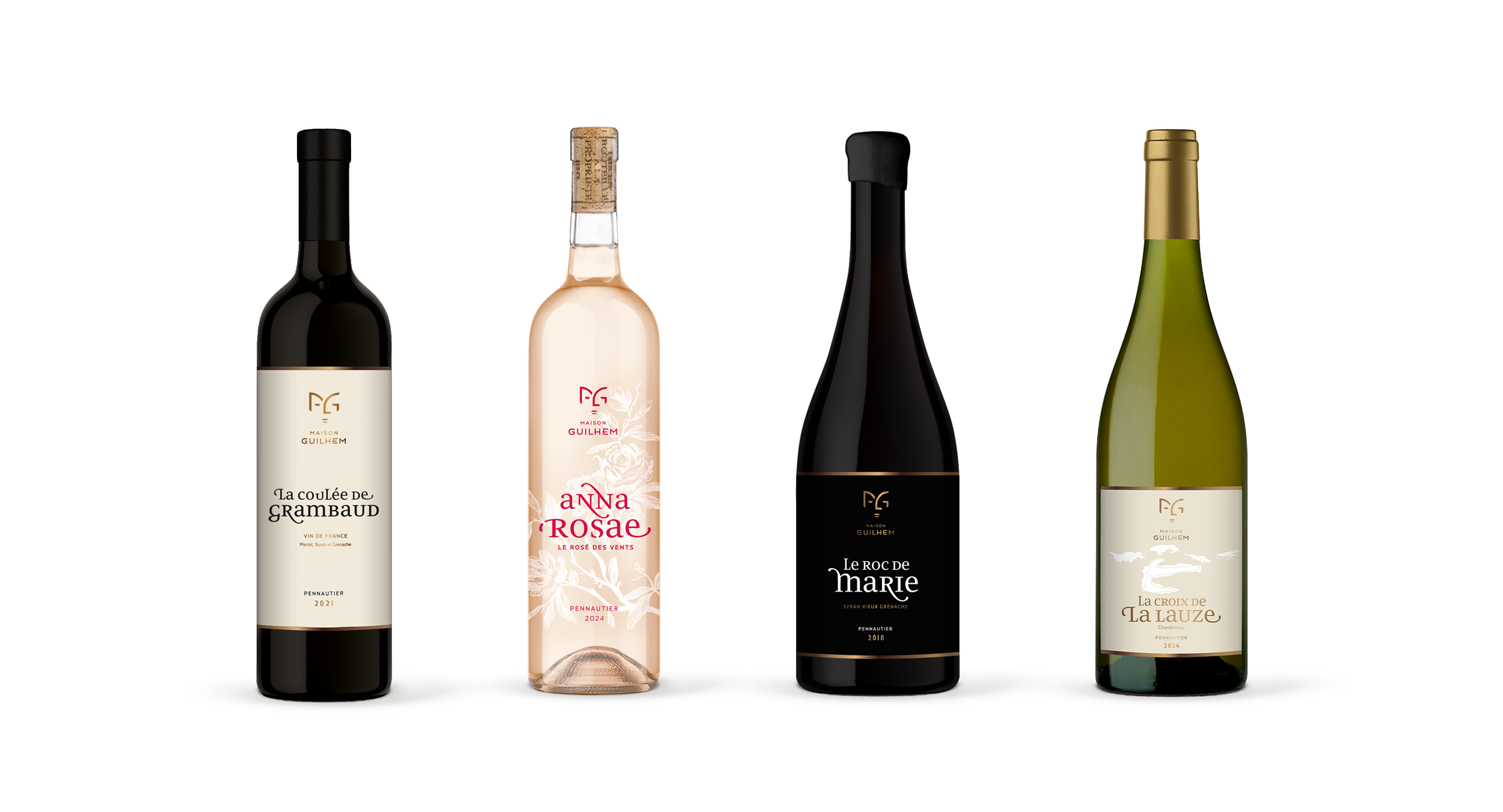 Four Maison Guilhem wine bottles: Le Roc de Marie premium red wine, La Coulée de Grambaud red wine, La Croix de la Lauze Chardonnay, Anna Rosae rosé wine, Maison Guilhem, French vineyard, branding and editorial project by Automne Studio.