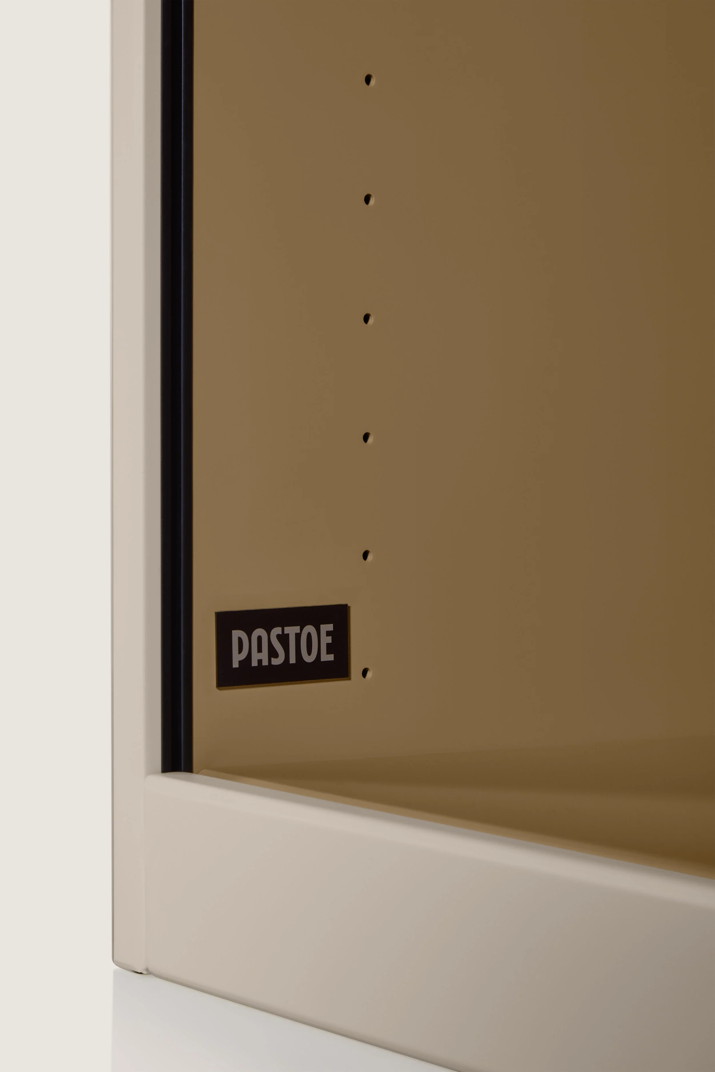 Close-up of a brown shelve, and a sign reading “PASTOE”, timeless dutch furniture design, branding project by Automne Studio.