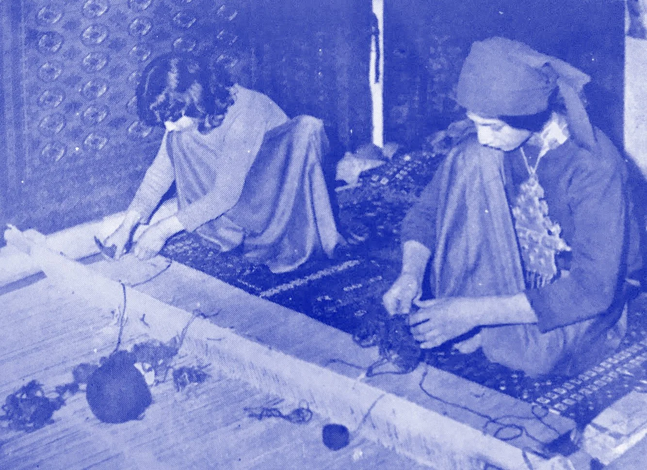 Two women in traditional clothing crafting rugs, Ishkar Zine, craftsmanship from countries at war, editorial project by Automne Studio.