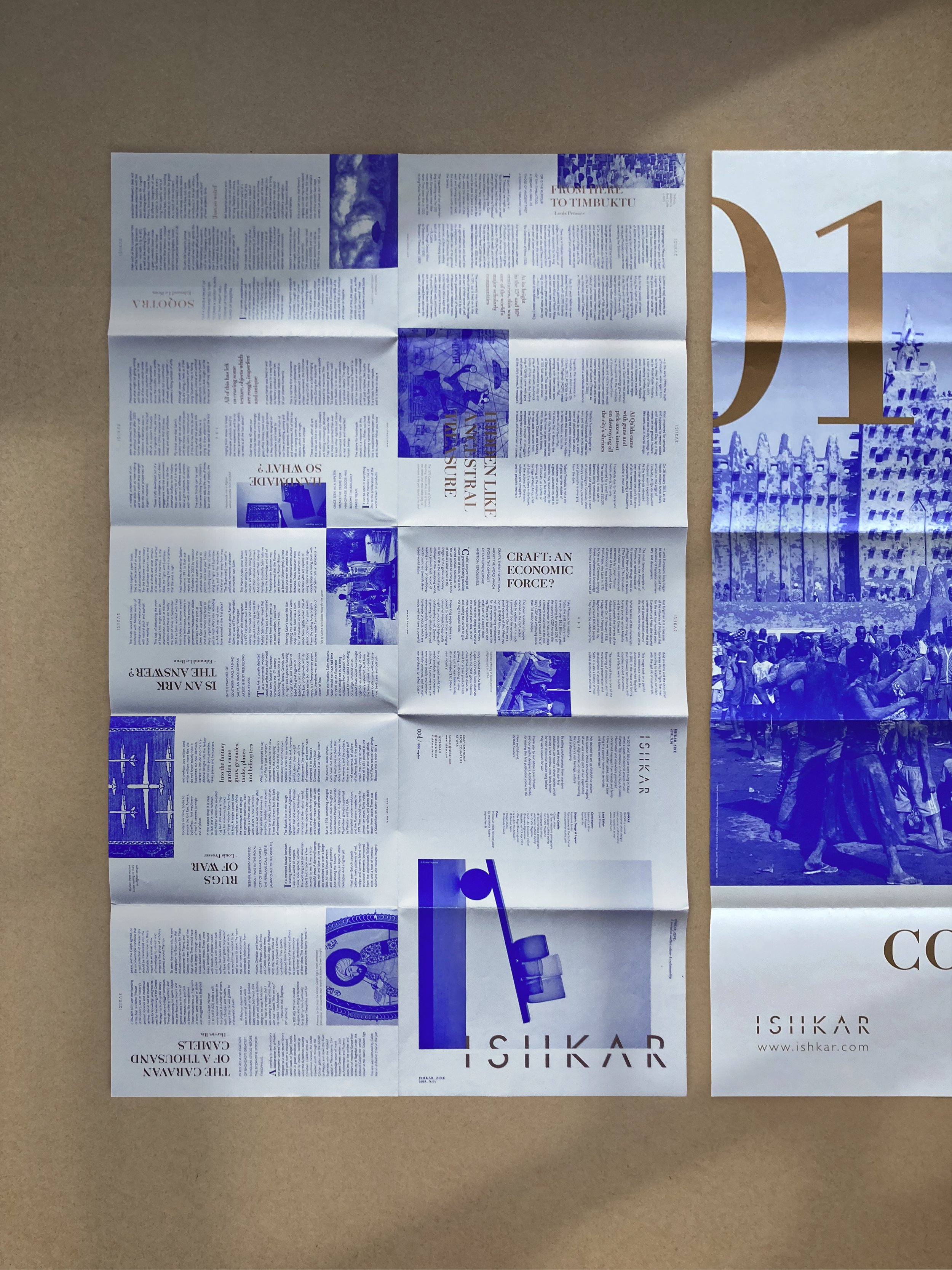 Open Ishkar Zine with blue-and-gold graphic designs, featuring articles, photographs, poster, craftsmanship from countries at war, editorial project by Automne Studio.
