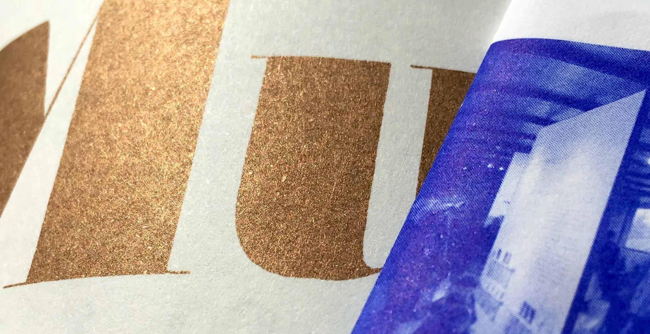 Close-up of a blue and gold printed photo, Ishkar Zine, craftsmanship from countries at war, editorial project by Automne Studio.
