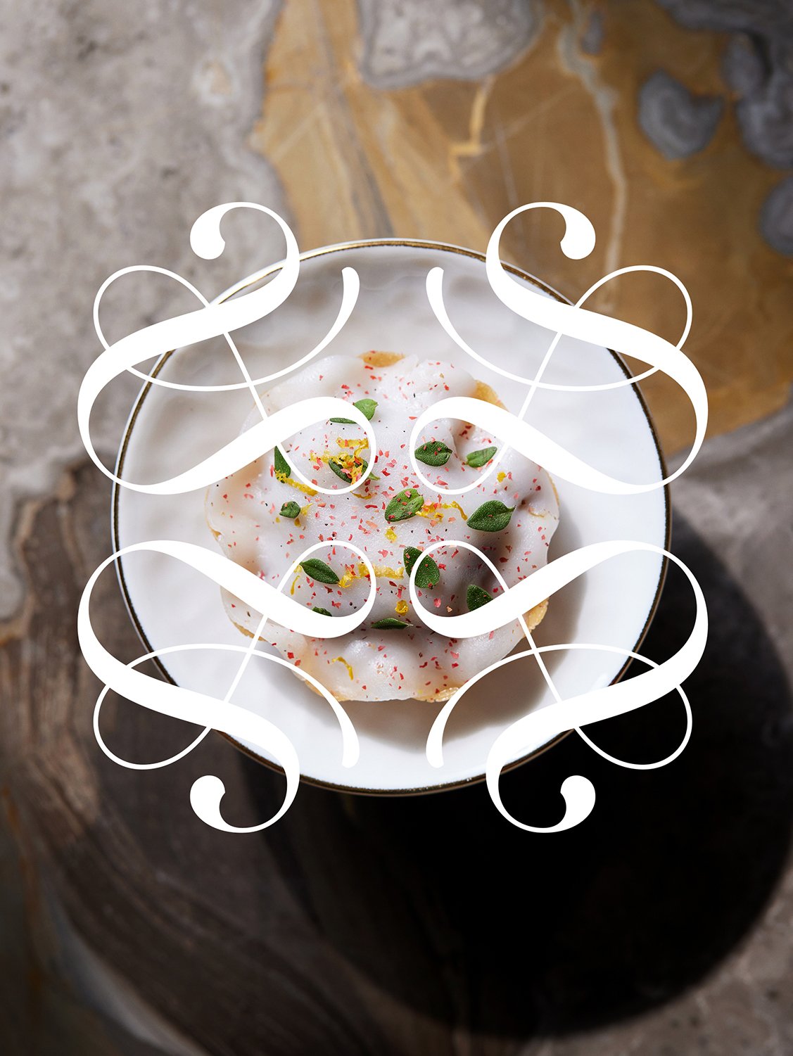 White Indulge plate with the Sarah-Linda decorative emblem, sensual tableware, branding, web design and editorial project by Automne Studio.